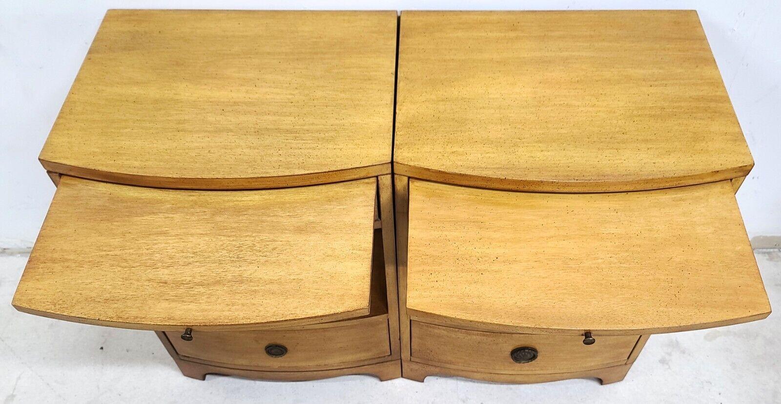 For FULL item description be sure to click on CONTINUE READING at the bottom of this listing.

Offering One Of Our Recent Palm Beach Estate Fine Furniture Acquisitions Of A Pair of Vintage Mid Century Modern Mahogany Nightstands by SLIGH
With