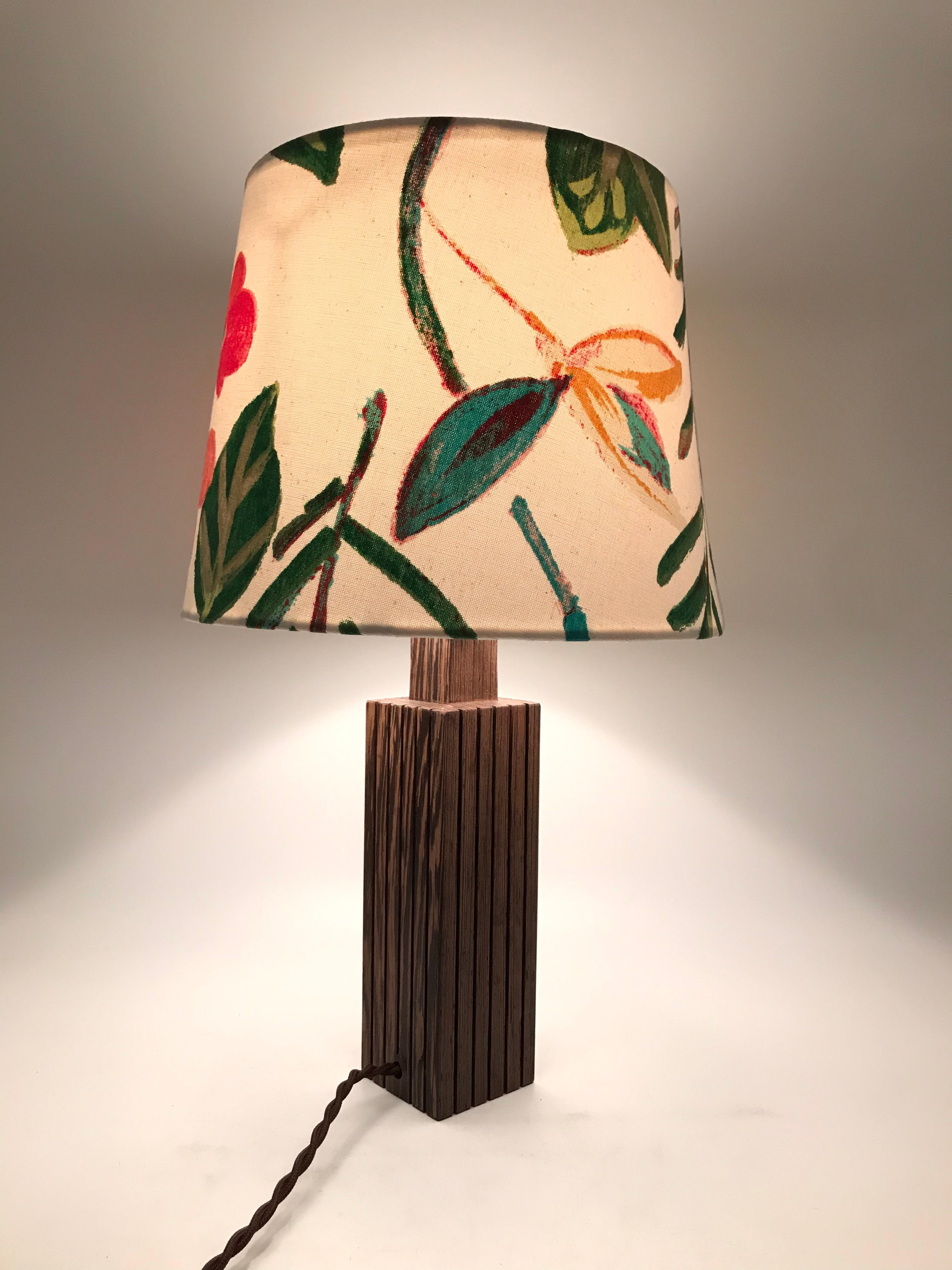 Vintage Danish Mid-Century Modern mahogany table lamp
A beautiful floral print on a white cotton background looks amazing together with the mahogany lamp.
The lamp retains its original Bakelite E27 bulb holder and has been fitted with a new twisted