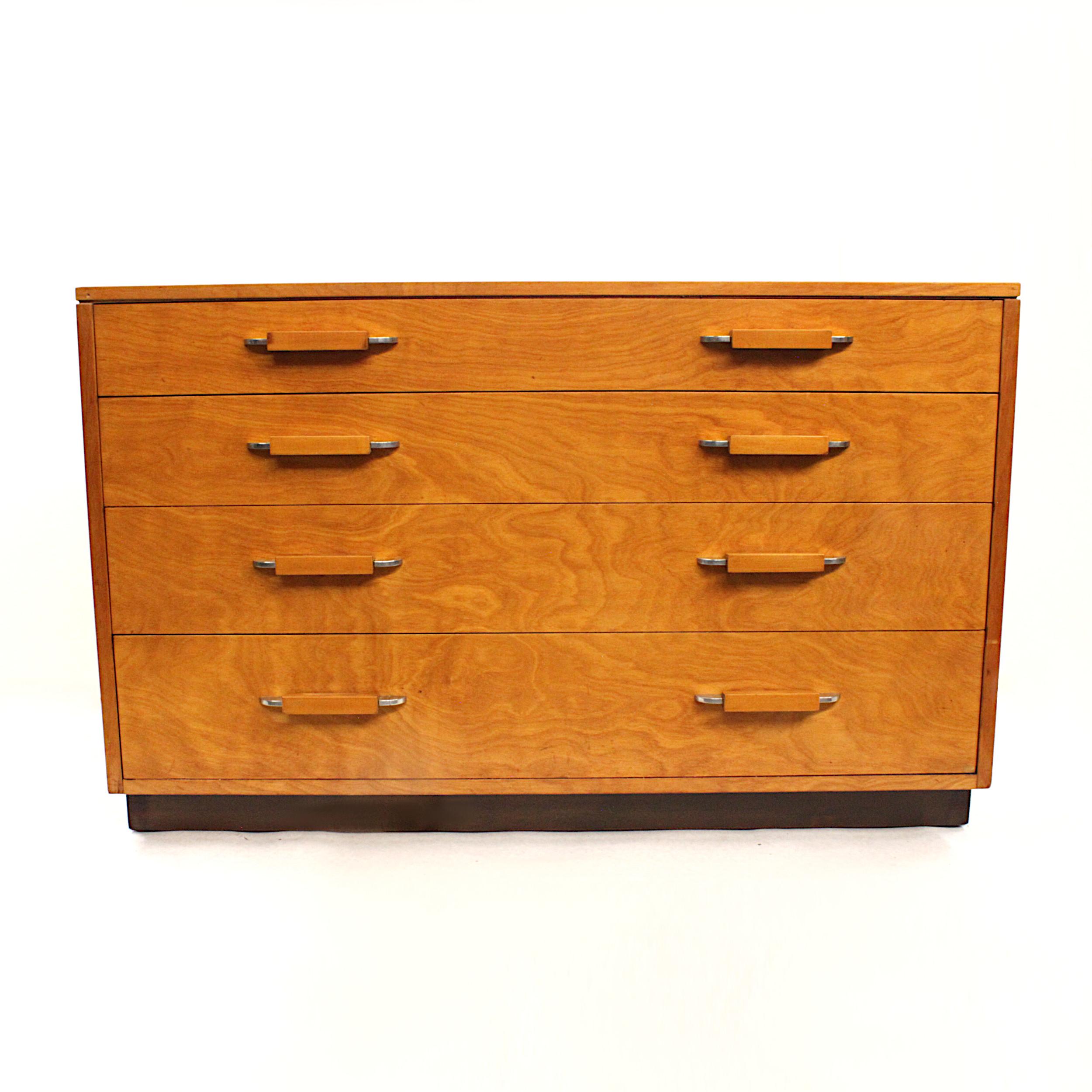 This is a fantastic Mid-Century Modern dresser by architect/designer Eliel Saarinen, father of architect/designer Eero Saarinen. Dresser features matched-grain Birch veneer, unique Birch/polished-aluminum hardware, and an off-set top that