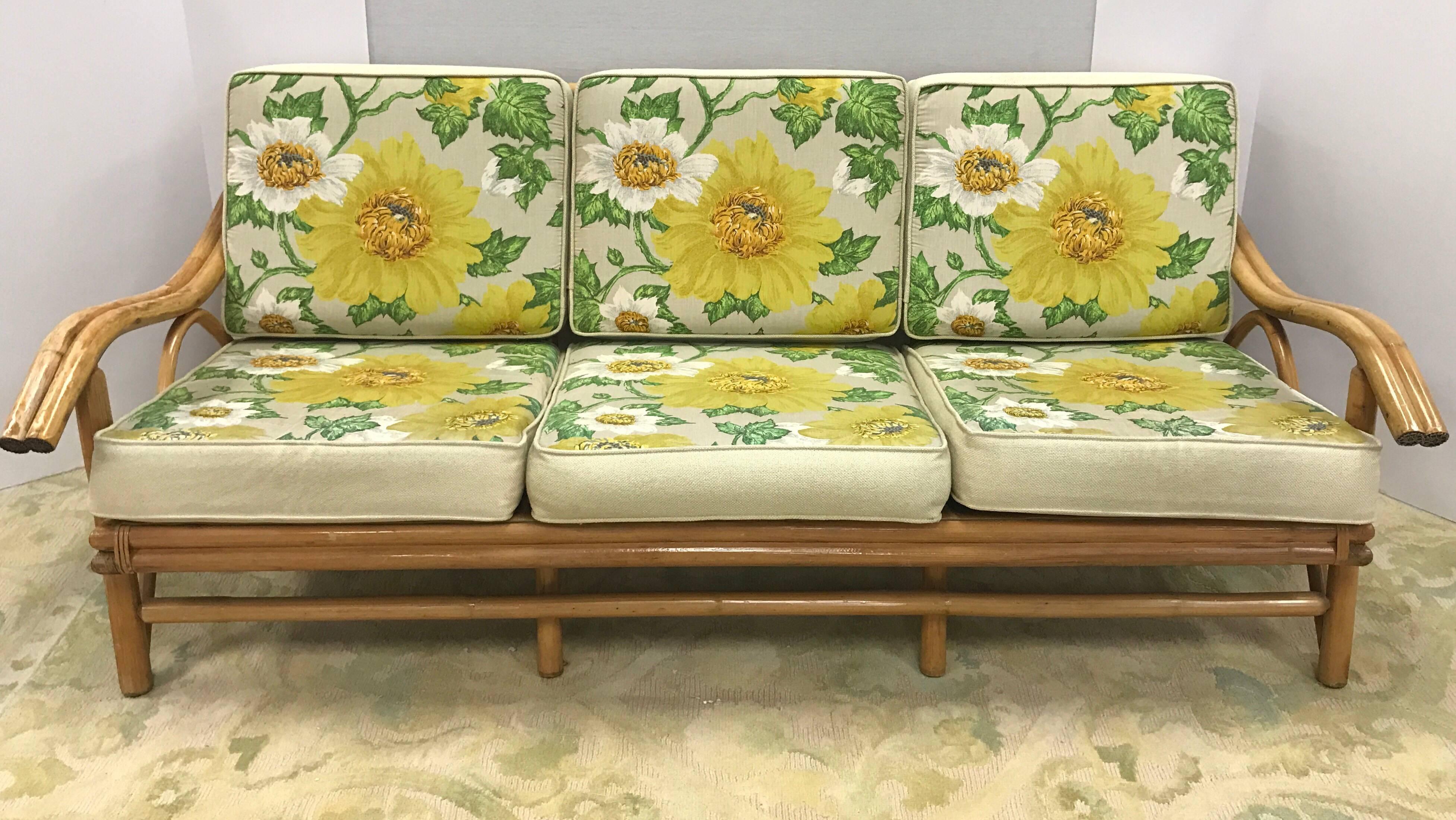 Mid-Century Modern classic three piece bamboo set. All original and in remarkably good condition, including fabric. Chair dimensions are 27 W x 32 D x 27 T x 17 seat height and sofa measurements are below.