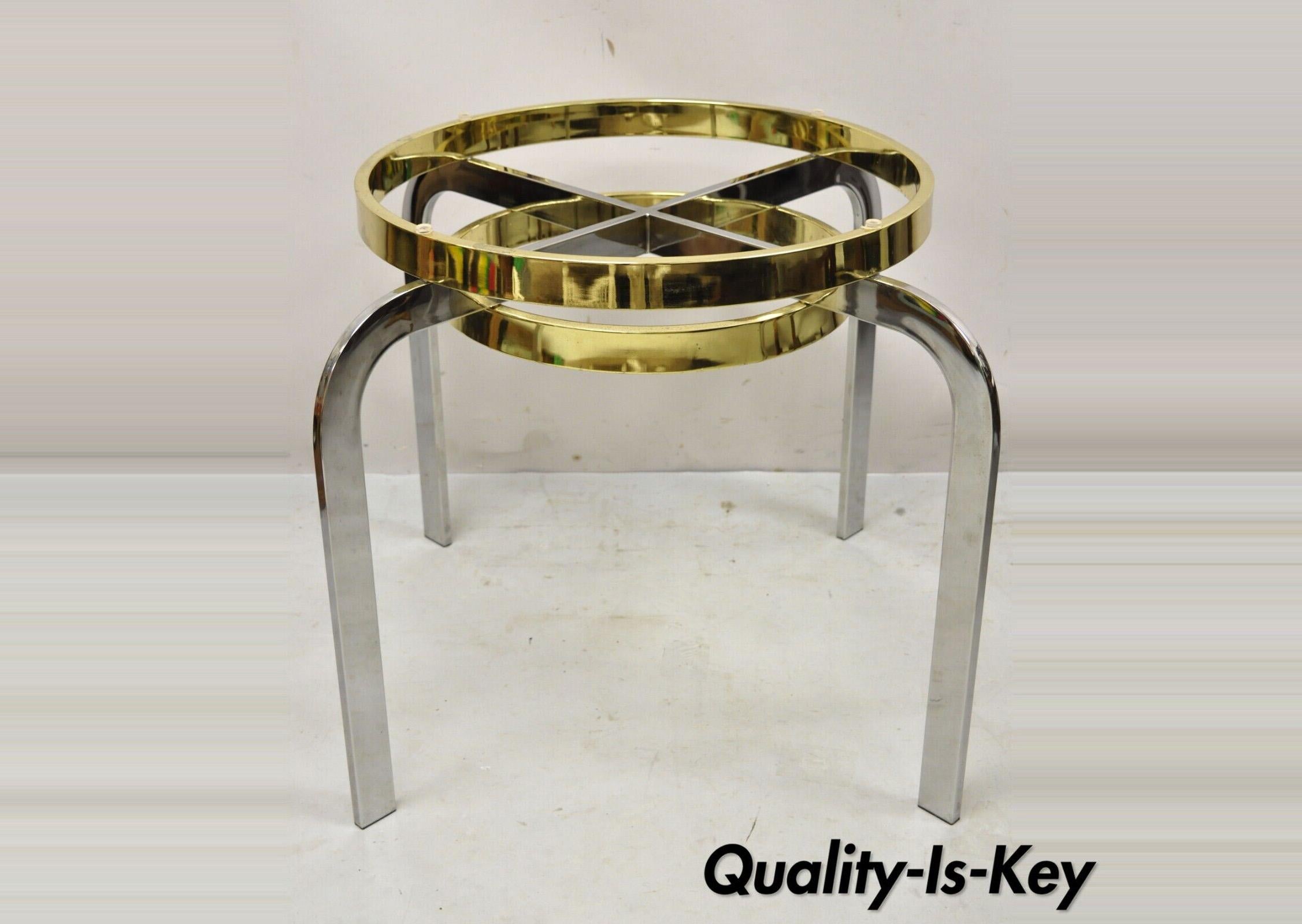 Vintage Mid-Century Modern Milo Baughman style chrome brass round side table. Item features a chrome and brass plated metal frame, clean modernist lines, great style and form, no glass top, possibly by Design Institute of America. Circa 1970s.