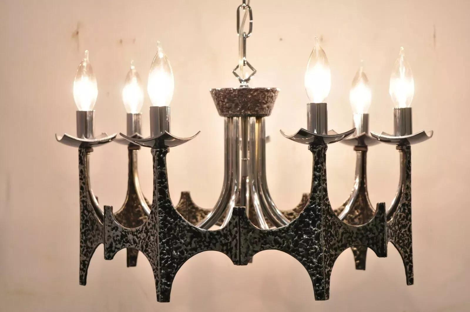 Vintage Mid Century Modern Mo Bridges Brutalist Hammered Chrome Chandelier. Item features (7) lights, unique brutalist design, intentional distressed finish, very nice vintage item, great style and form. Circa Mid 20th Century. Measurements: 12