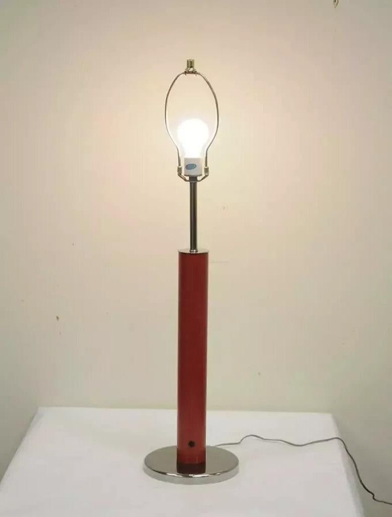 Vintage Mid Century Modern Modernist Red Cylinder Chrome Table Desk Console Lamp. Item features clean modern lines, an original porcelain light socket. The maker is unconfirmed. Circa Mid 20th Century. Measurements: 38