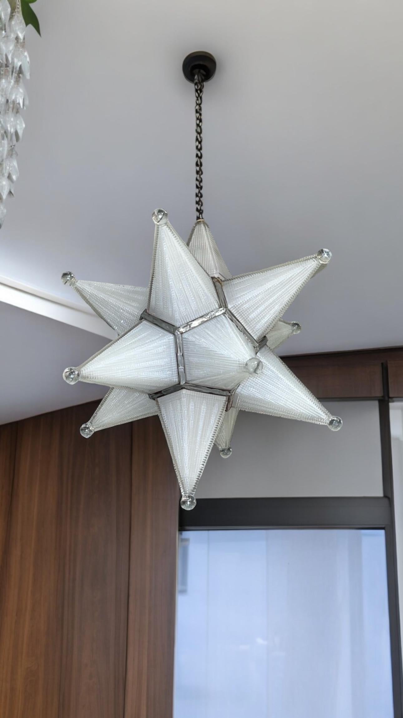 Vintage (mid-century) hanging lamp in the shape of a Moravian star, beautifully crafted from white metal and molded, textured milk glass panels with clear glass spheres at the star points.  18 inches tall and wide/deep.  With one standard socket and