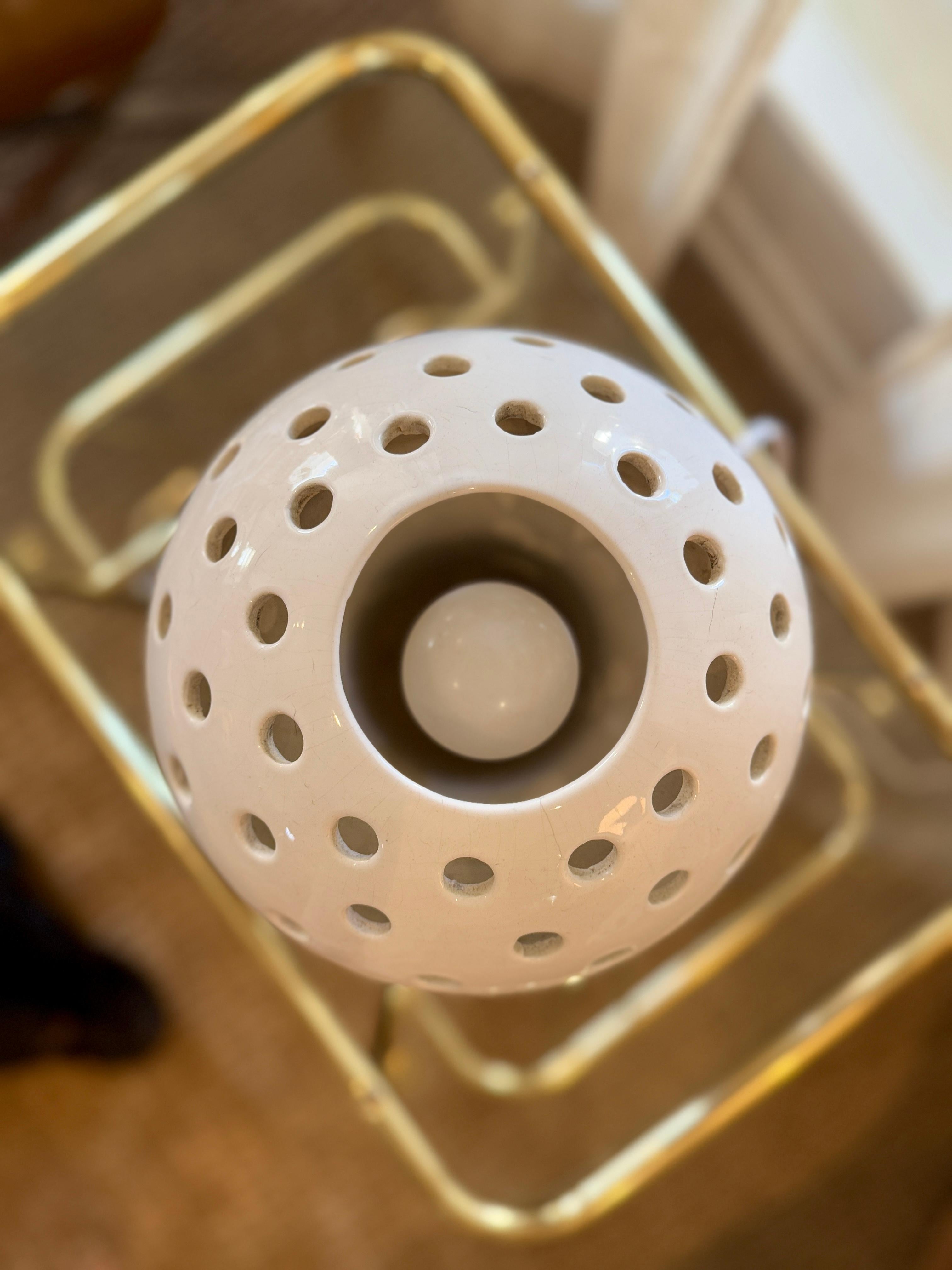 Vintage mid century modern mushroom lamp, circa 1960s. This ceramic lamp was made by Canadian potter, Maurice Chalvignac. This beauty is all one piece, and is perforated with holes to allow light to cast a lovely pattern onto the wall. The glaze is