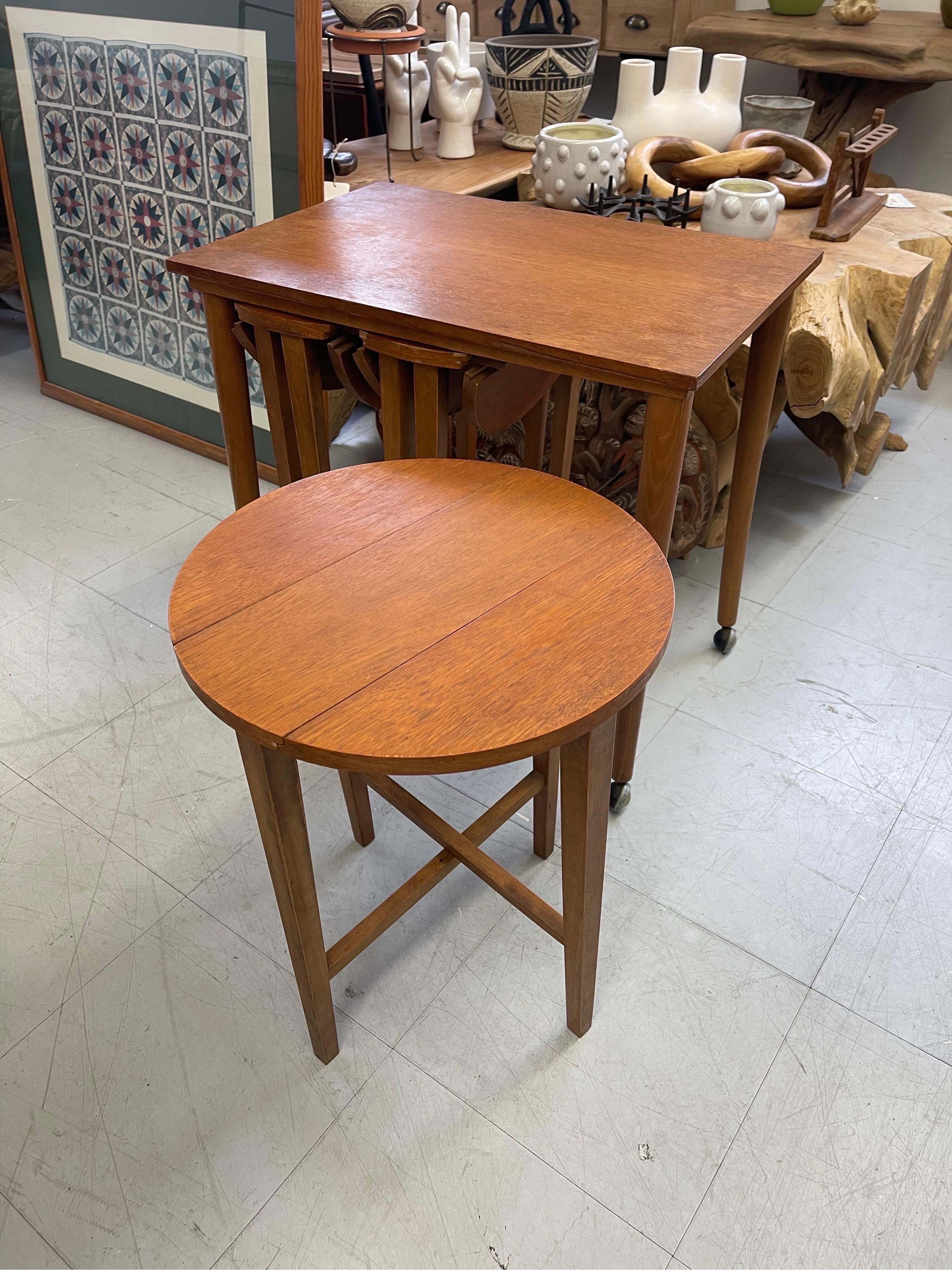 Vintage Mid-Century Modern Nesting Tables on Casters. UK Import In Good Condition For Sale In Seattle, WA