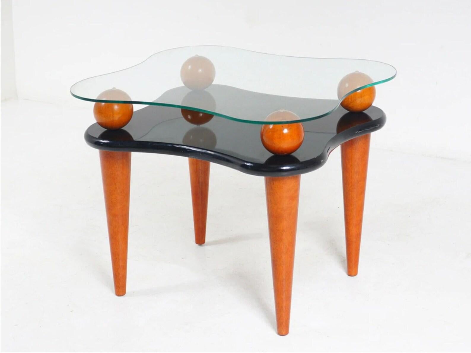 Mid-Century Modern vintage one wavy Lacquer side table.
Tapered walnut legs and ball details with black lacquer and glass tiered table top. 
Very good vintage condition! little to no wear.

Dimensions: (inches)
H: 23