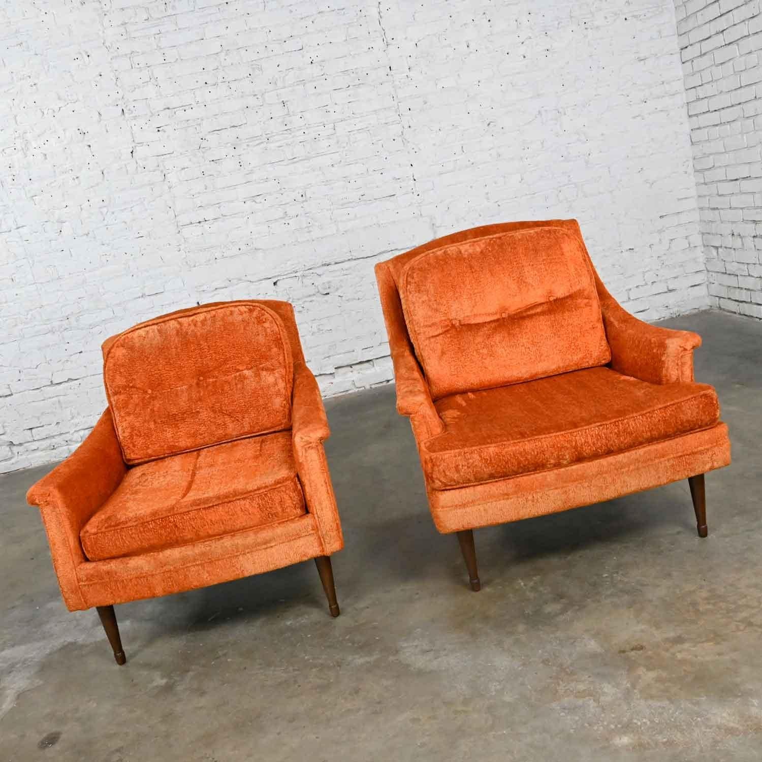 Fabulous Mid-Century Modern orange brushed chenille pair of his & hers lounge chairs. Beautiful condition, keeping in mind that these are vintage and not new so will have signs of use and wear. The outer edges of the corners of each chair have a bit