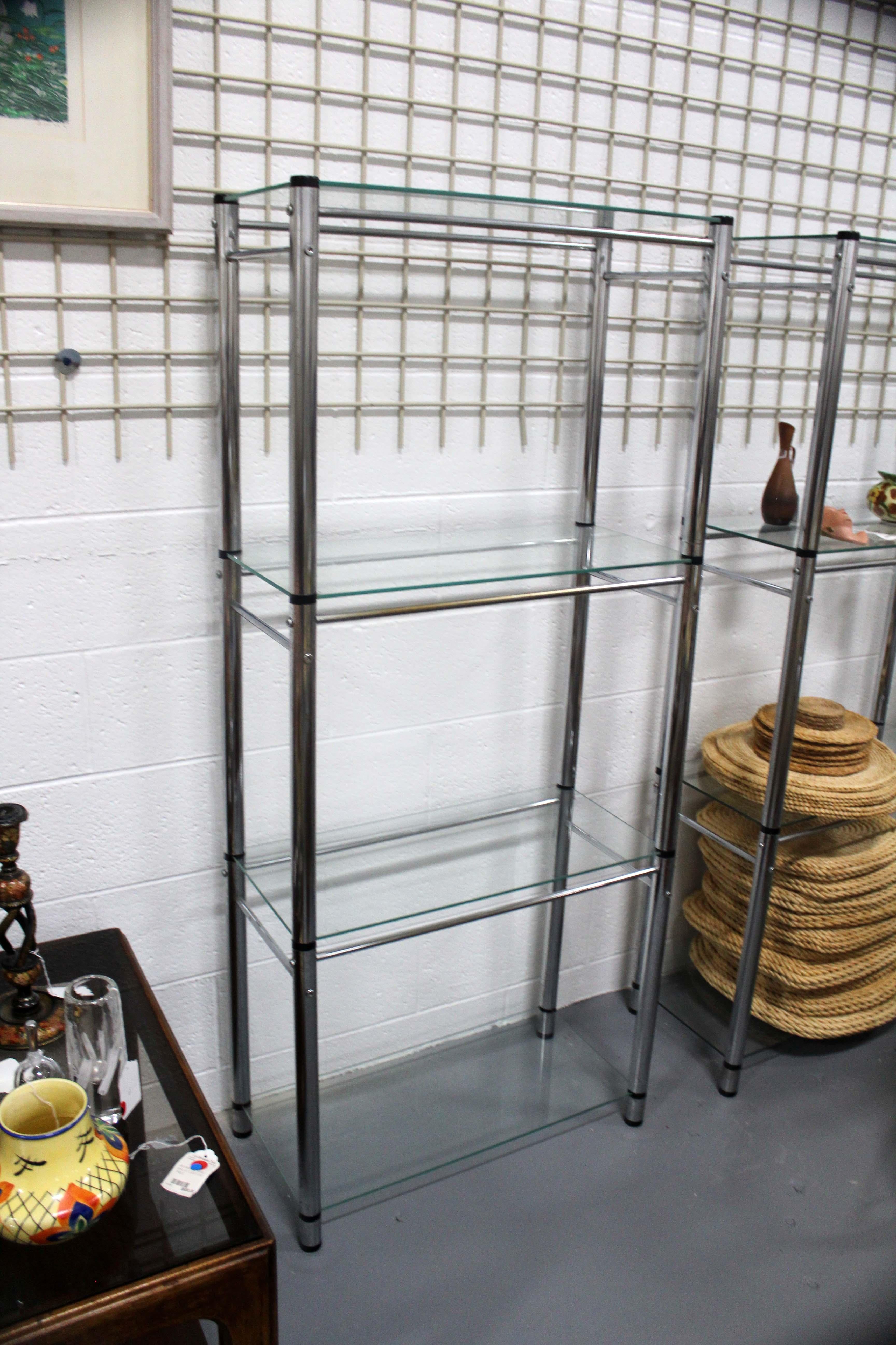 For your consideration is this pair of vintage chrome and glass etagere shelving units. Dimensions: 26