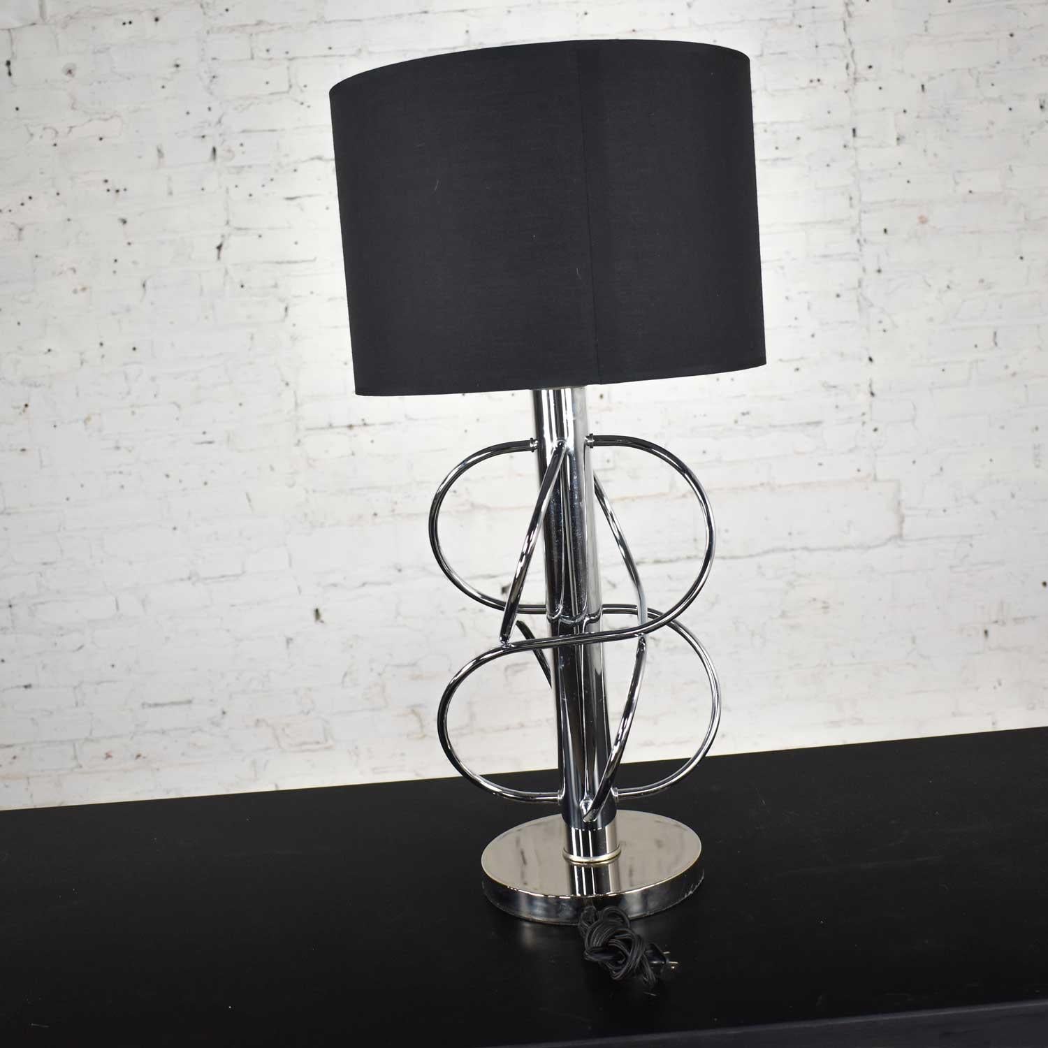 Striking vintage Mid-Century Modern polished chrome table lamp with new black Fenchel drum shade. Wonderful condition although there is a tiny ding in the shaft and age-appropriate wear as you would expect with a vintage piece. Please see photos.