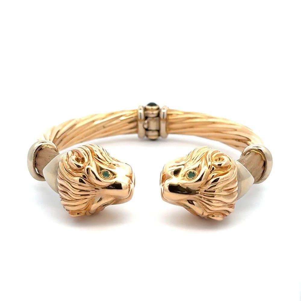 Simply Beautiful! Vintage Mid Century Modern Show Stopper Iconic Double Lion Head Spring Hinged Statement Gold Bangle Bracelet. Hand crafted in 14K Yellow Gold. Circa 1970s. More Beautiful in real time! Classic and Chic…Illuminating your look with