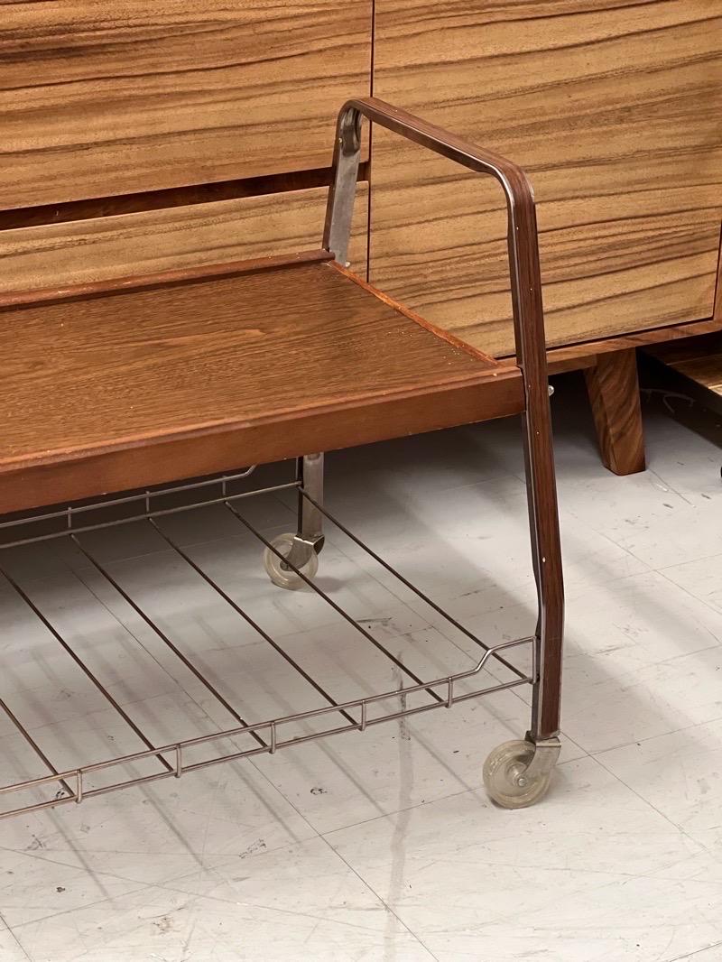 Vintage Mid-Century Modern rolling accent table 

Dimensions. 27 1/2 W ; 20 D ; 23 3/4 H.