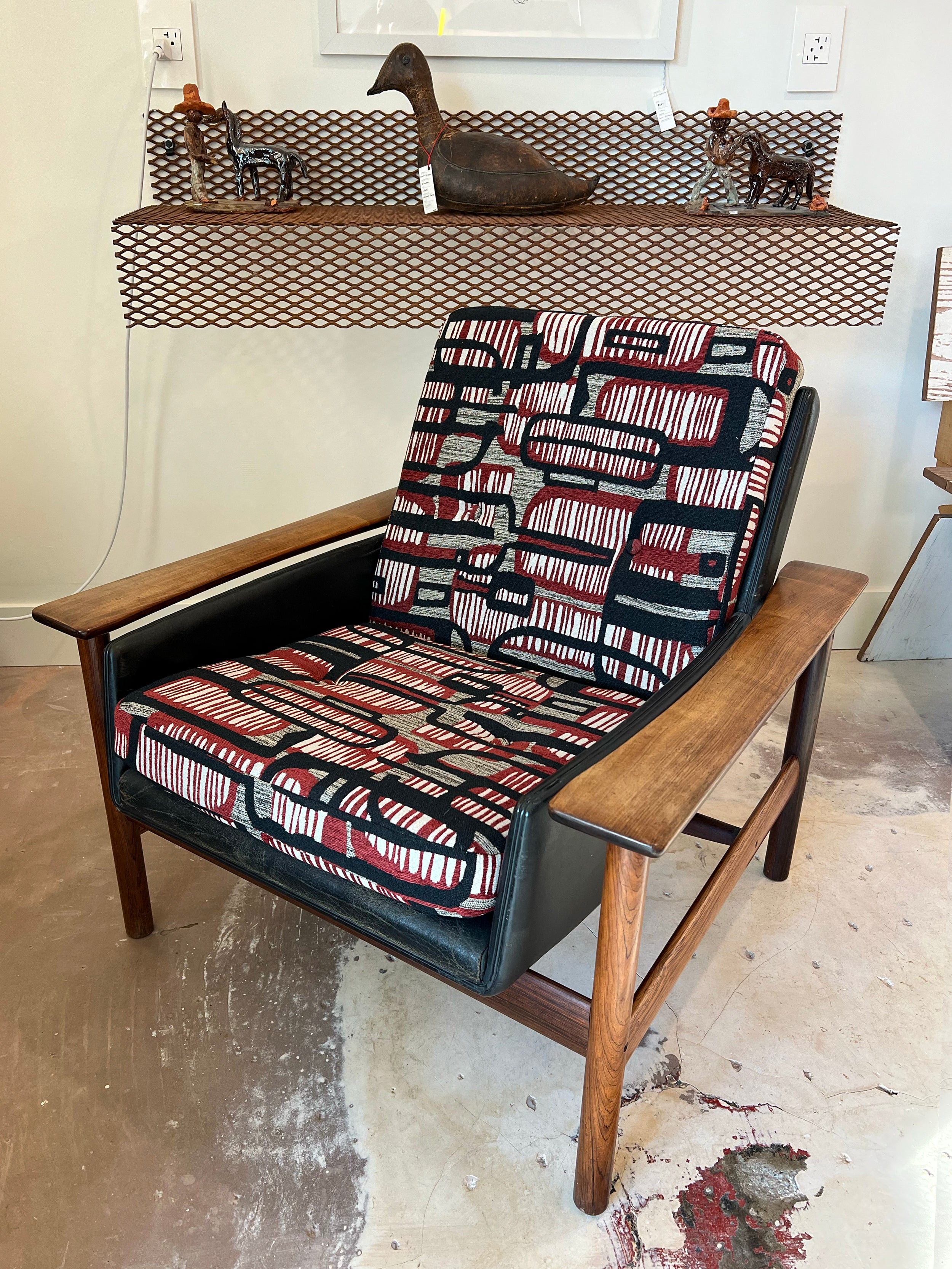 Vintage rosewood lounge chair by Sven Ivar Dysthe for Dokka Mobler. The frame is in great condition, nice color on the rosewood and solid construction. The leather is original to the chair and has wear consistent with age (see photos). The cushions