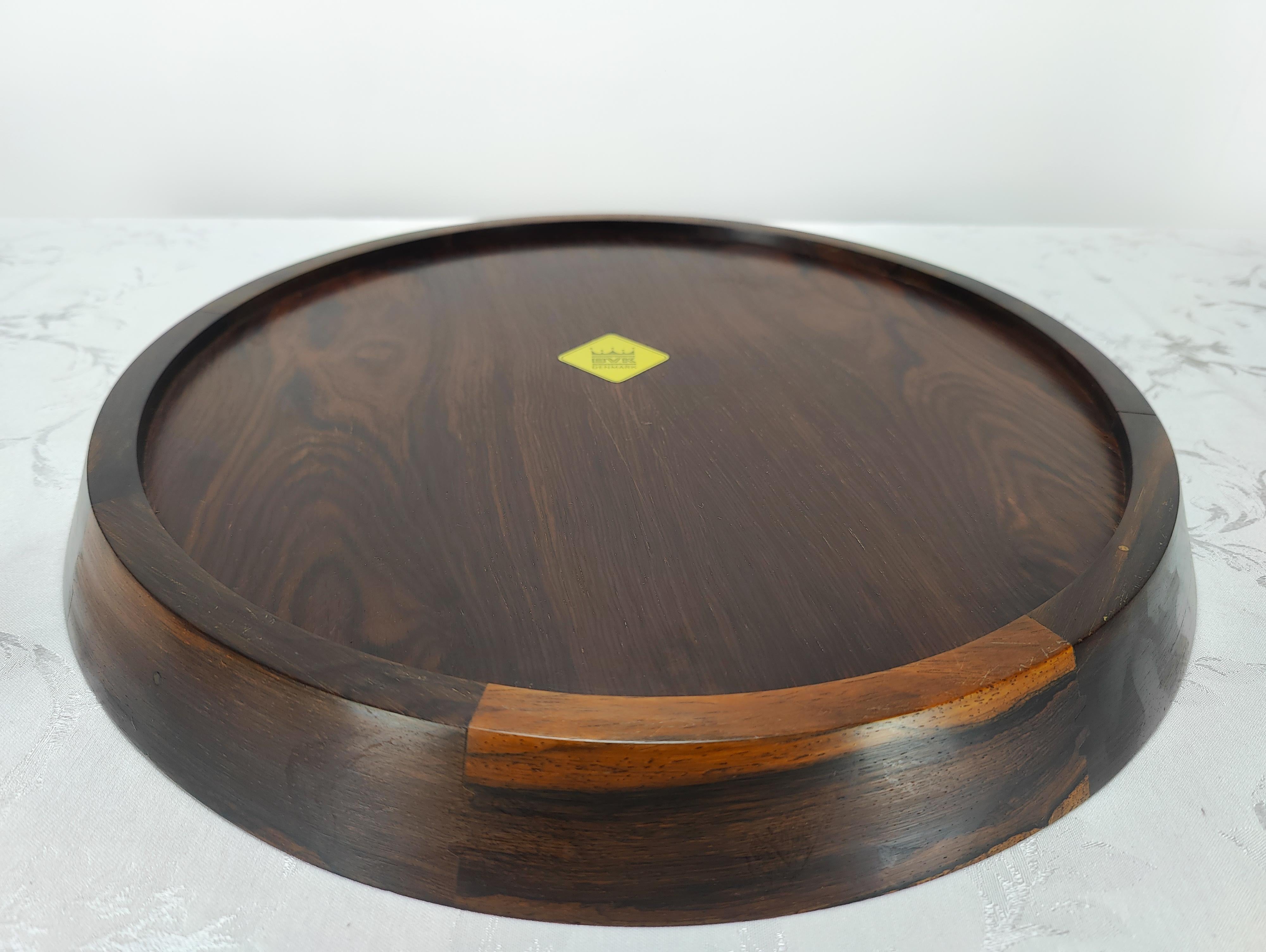 Rosewood serving tray, designed and made in Denmark by BVK (labeled)

Condition: Overall very good original condition with minor surface level scratches. Would fit right in & be lovely in any midcentury styled home. Would give any room with light