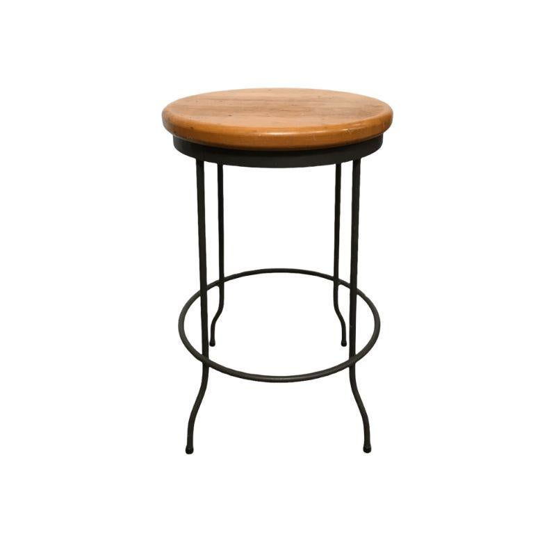 Vintage Mid-Century Modern style round cast iron frame stool chair with mahogany seat. $375
 
This beautiful and practical stool chair features nicely bent cast iron legs, bringing an elegant look to a sturdy piece. Its seat is made of mahogany