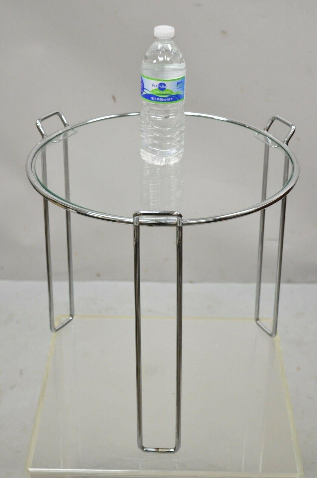 Vintage Mid-Century Modern round modernist chrome frame glass side table. Item features chrome sleek frame, round glass top, very nice vintage item, clean modernist lines. Circa mid to late 20th century. Measurements: 16