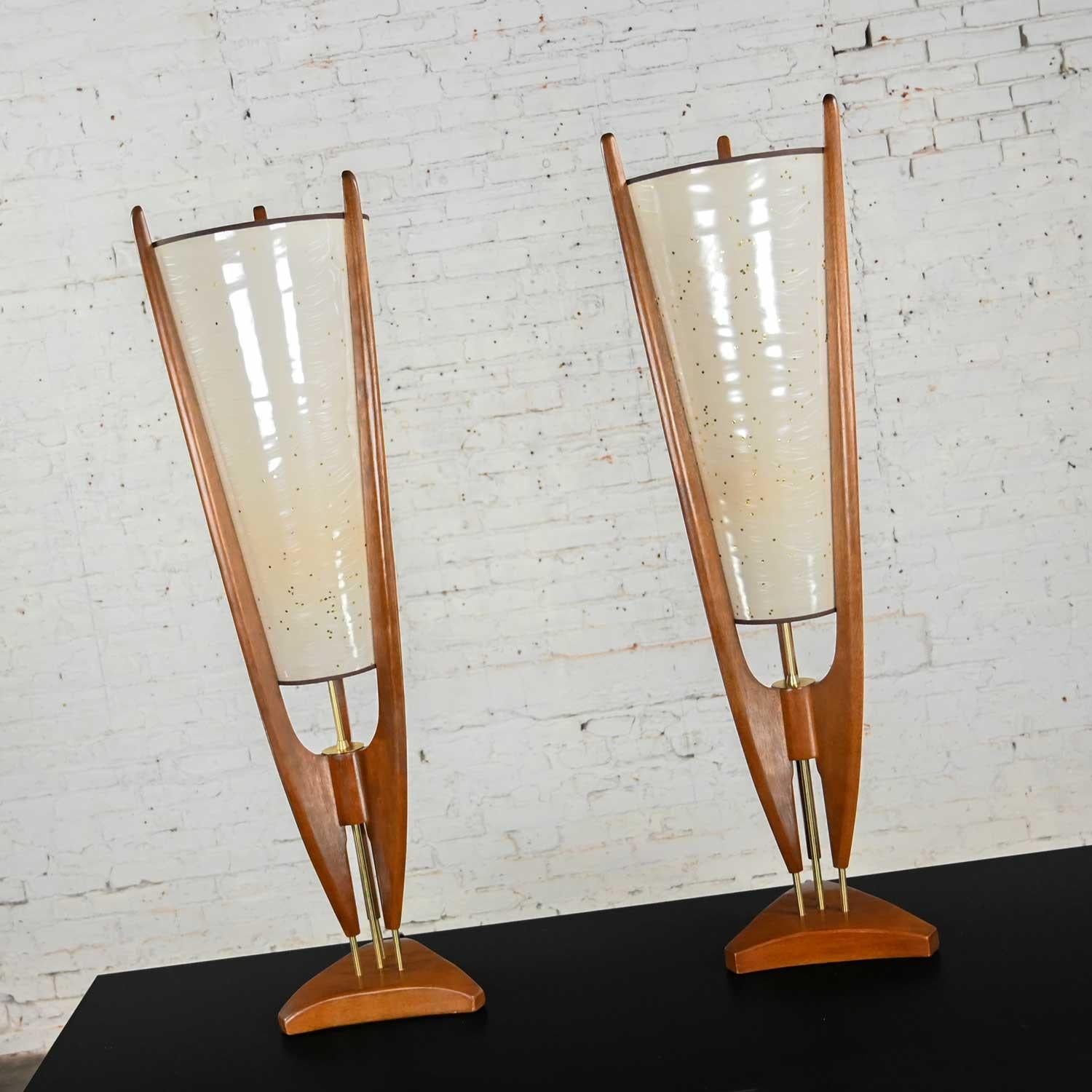 Stunning vintage mid-century modern sculpted cone table lamps by Arthur Jacobs for Modeline. Comprised of korina wood, brass stems, and original plastic cone shades. Beautiful condition, keeping in mind that these are vintage and not new so will