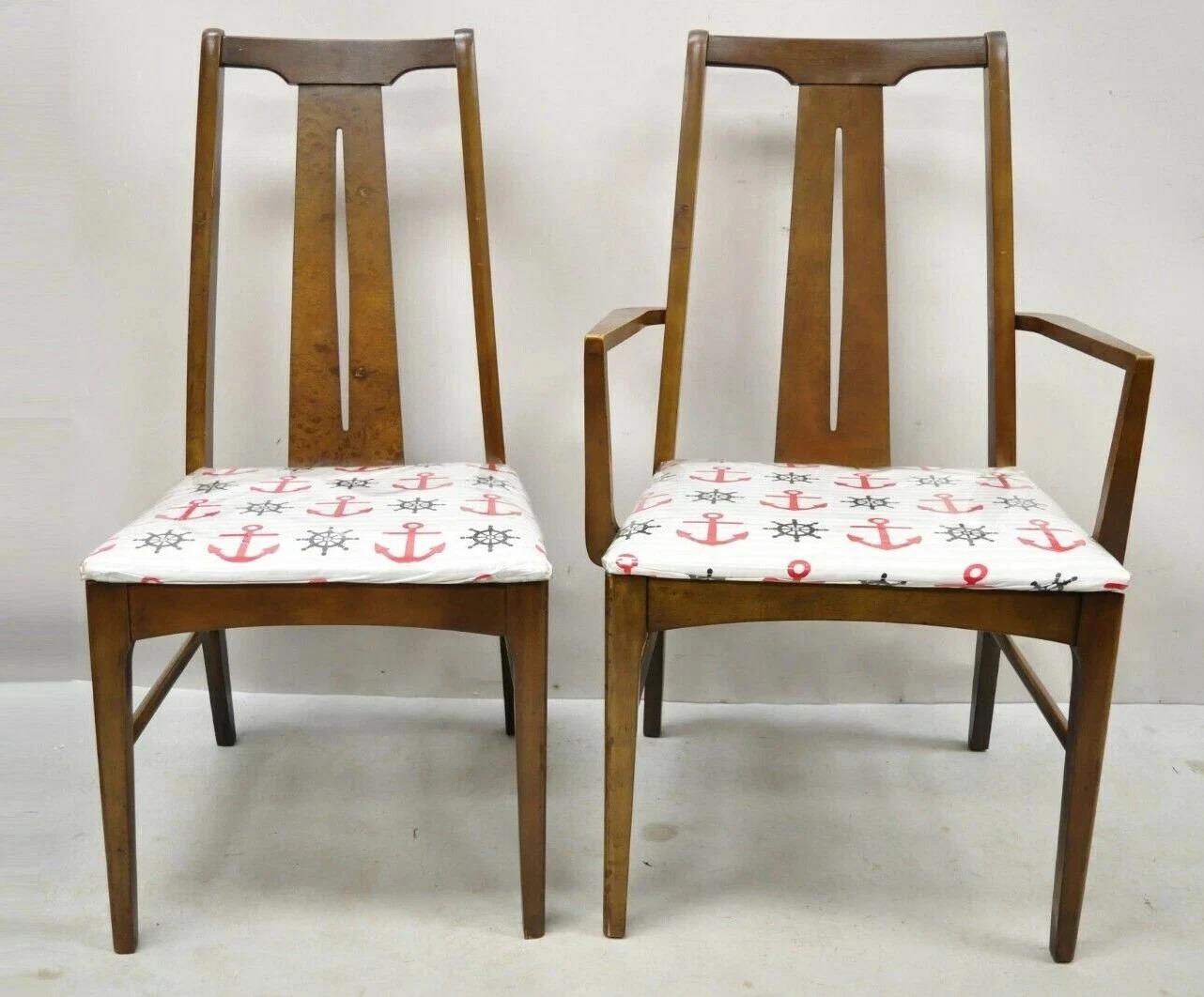 Please message us with your zip code to request a more reasonable domestic U.S. shipping quote.

Vintage Mid Century Modern Walnut Dining Room Chairs - Set of 6. Listing includes (2) arm chairs, (4) side chairs, beautiful wood grain, tapered legs,