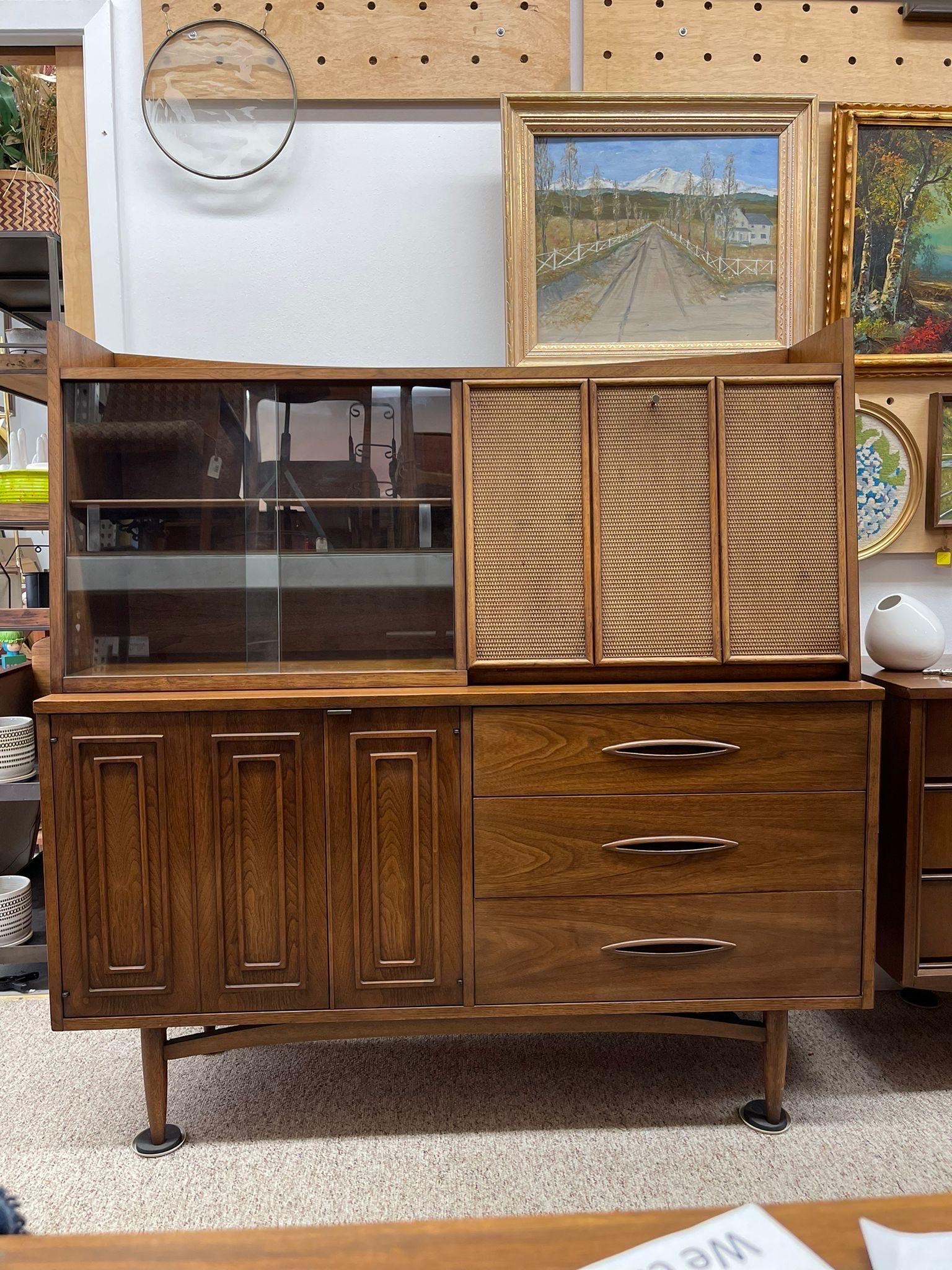 Hutch with Rattan Drop Front Cabinet Space as well as  Glass Front Shelving. The Top of the Piece is Completely Detachable. The Shelving with the Cabinet is Removable and Adjustable. Sculptured Details on Drawer Pulls and Stretcher , Tapered Legs.
