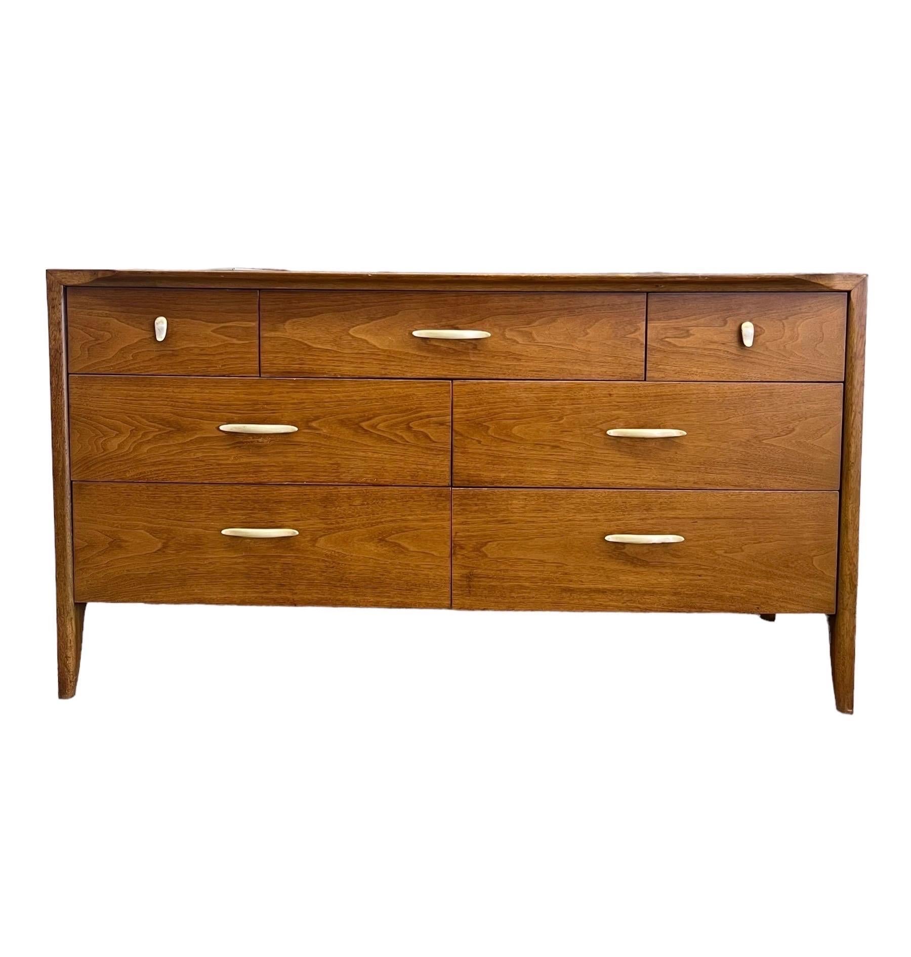 A stylish Mid-Century Modern seven-drawer dresser or credenza by John Van Koert for the 