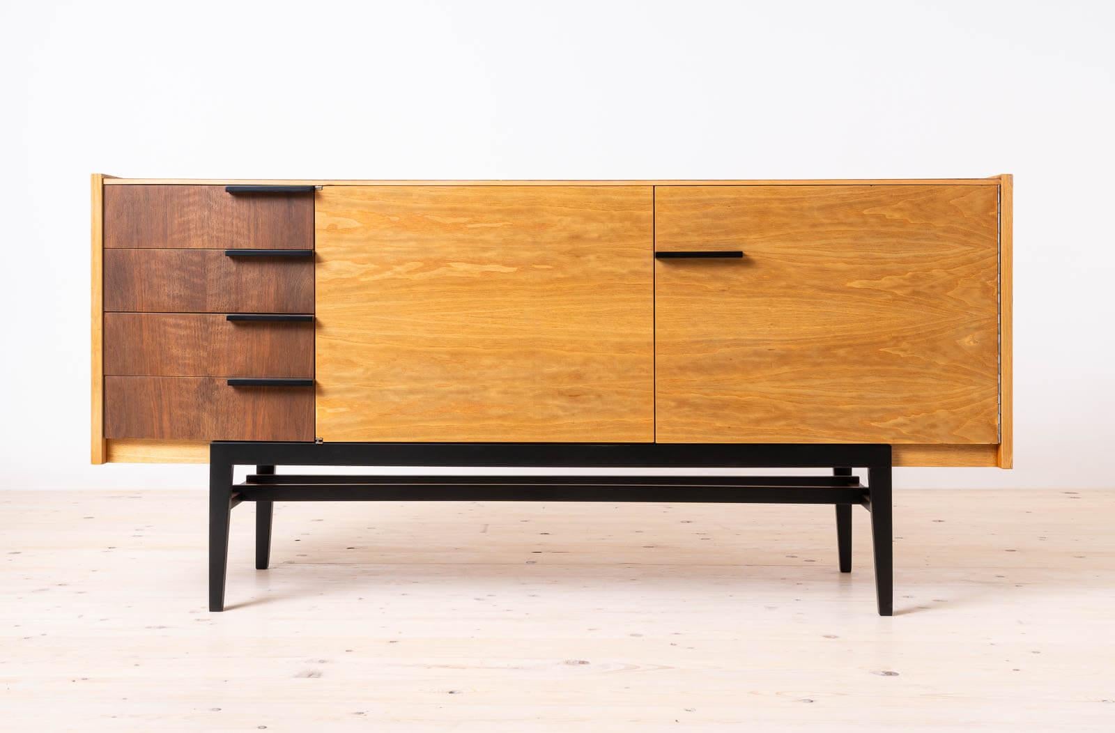 This exquisite sideboard, crafted in the 1960s in former Czechoslovakia, exemplifies the epitome of mid-century modern design. A testament to the renowned craftsmanship of UP ZAVODY and the creative vision of Frantisek Mezulanik, it embodies both