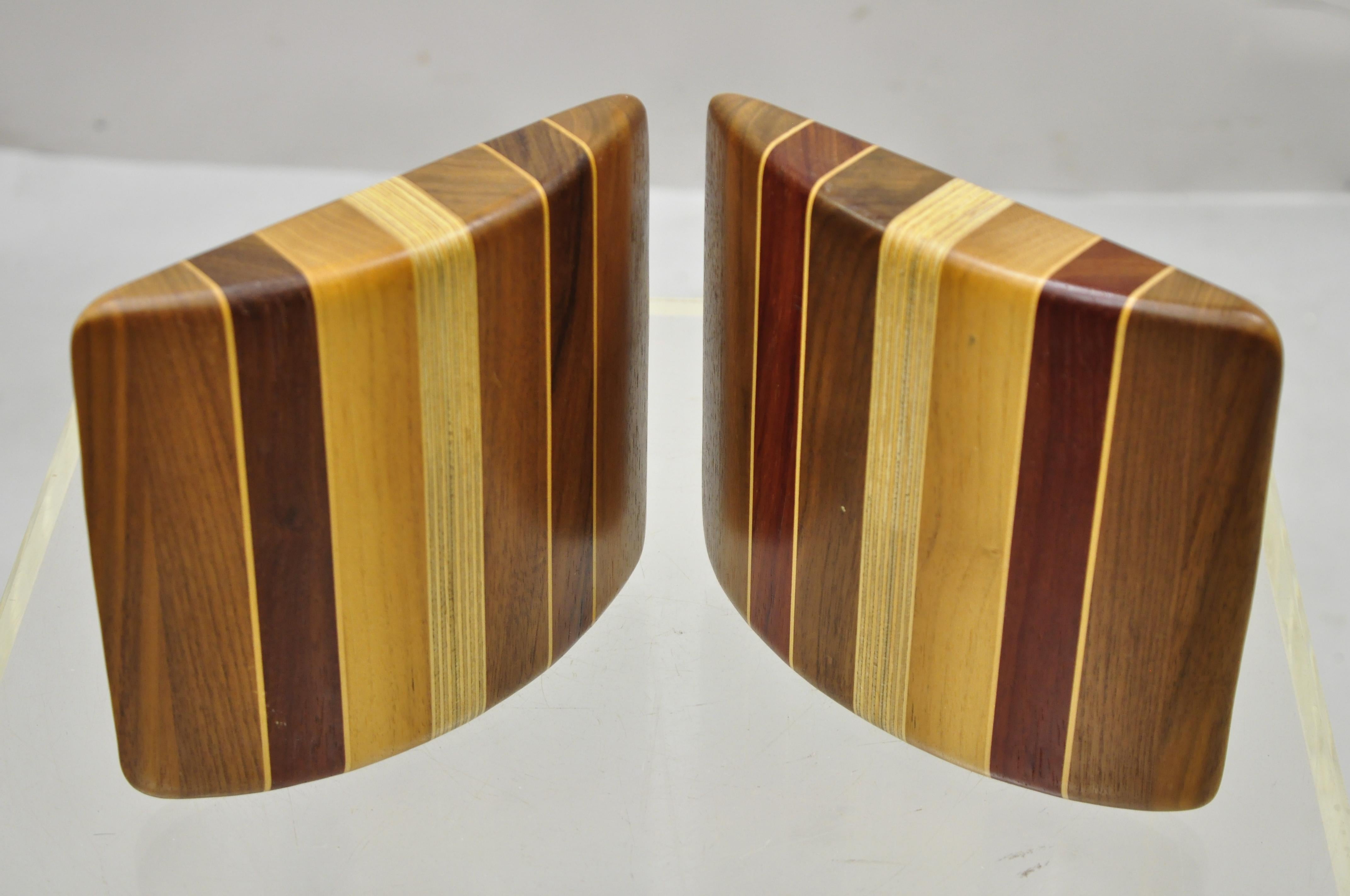 Vintage Mid-Century Modern solid wood with inlay curved bookends - a Pair. Item features solid wood construction, beautiful wood grain, nice inlay, clean modernist lines, quality craftsmanship, great style and form. Circa Mid 20th Century.
