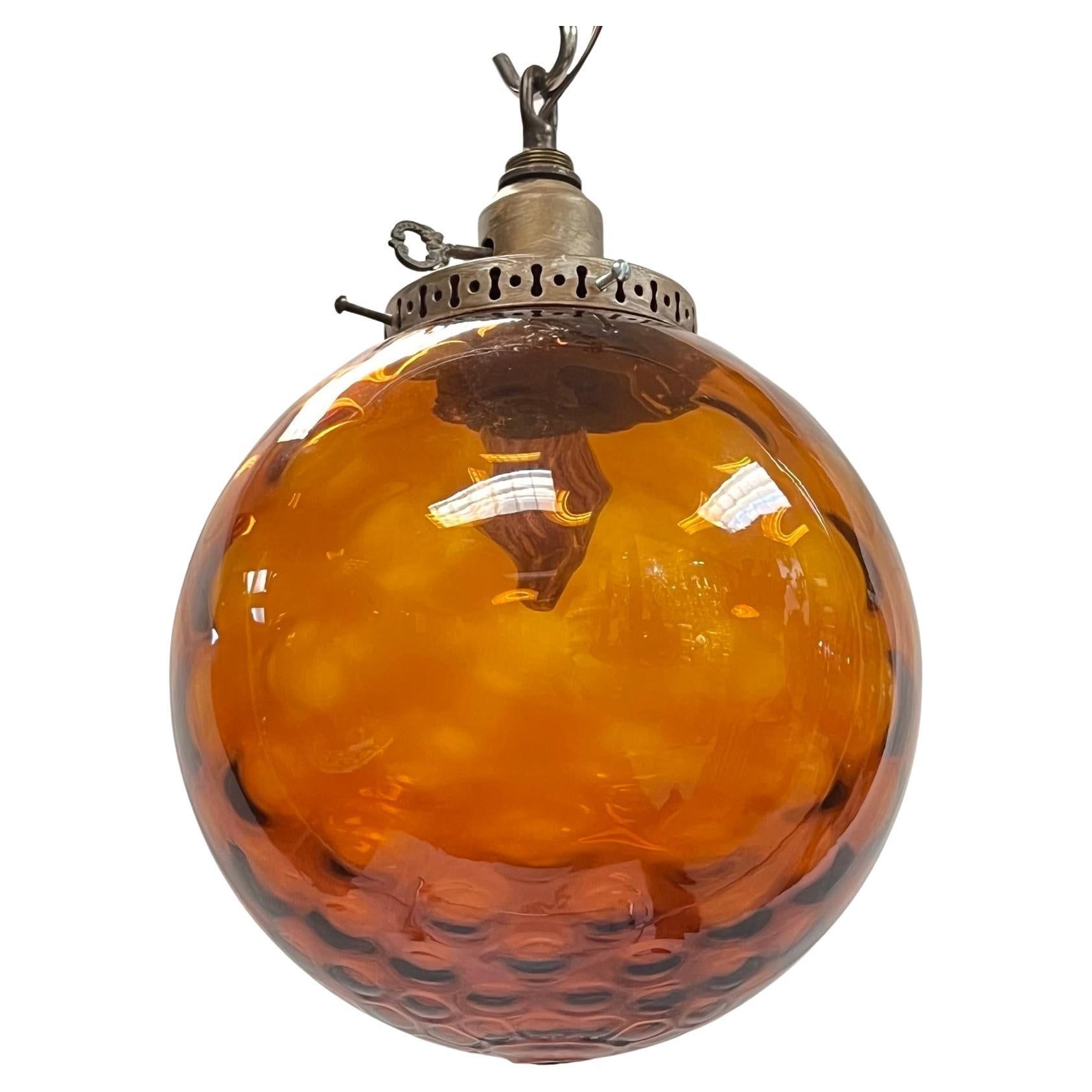 Vintage Mid-Century Modern Spherical Amber Glass Hanging Lamp For Sale
