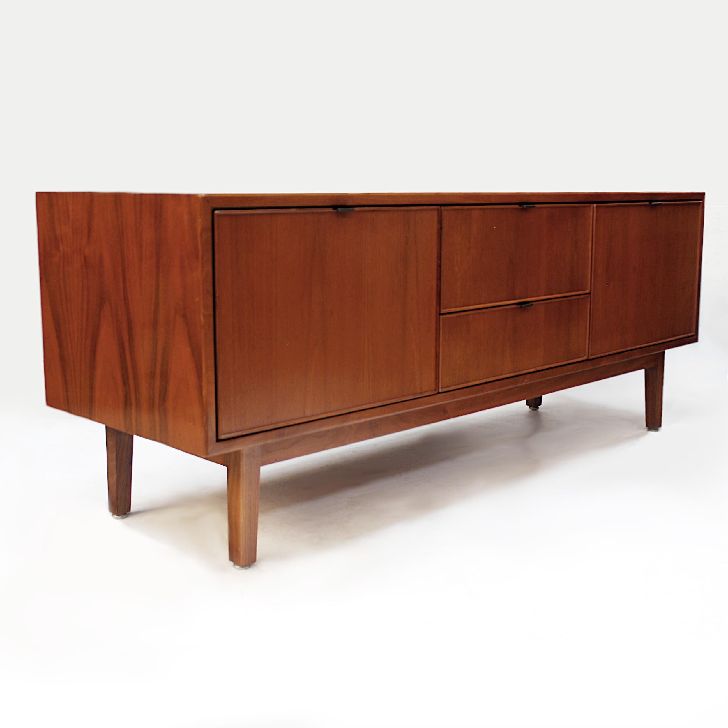 This wonderful Mid-Century Modern credenza by Stow Davis is full of unique features. Designed by Alexis Yermakov as part of the 