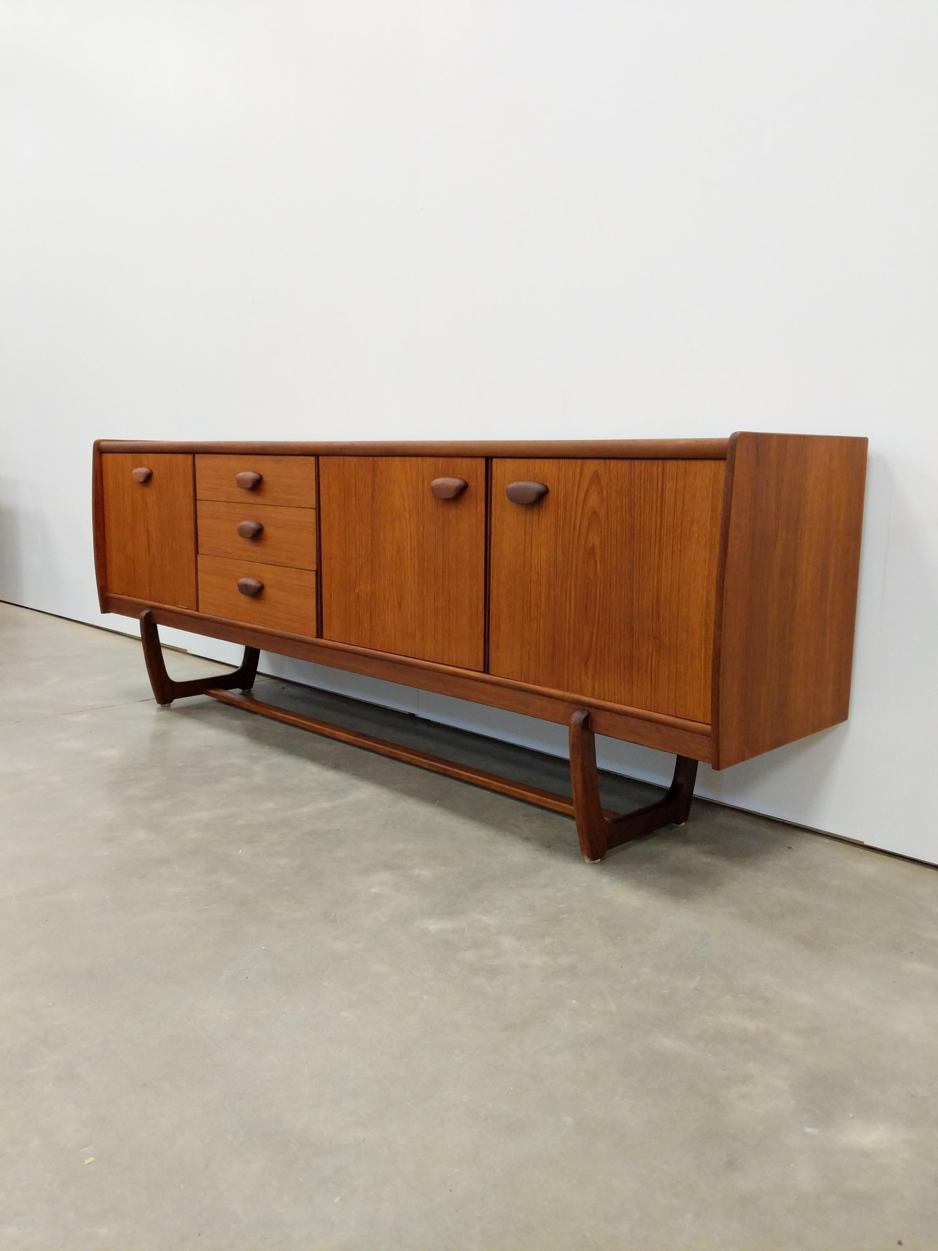 Authentic vintage mid century modern teak credenza / sideboard / console.

By Portwood.

This piece is in excellent condition with very few signs of age-related wear (see photos).

If you would like any additional details, please contact