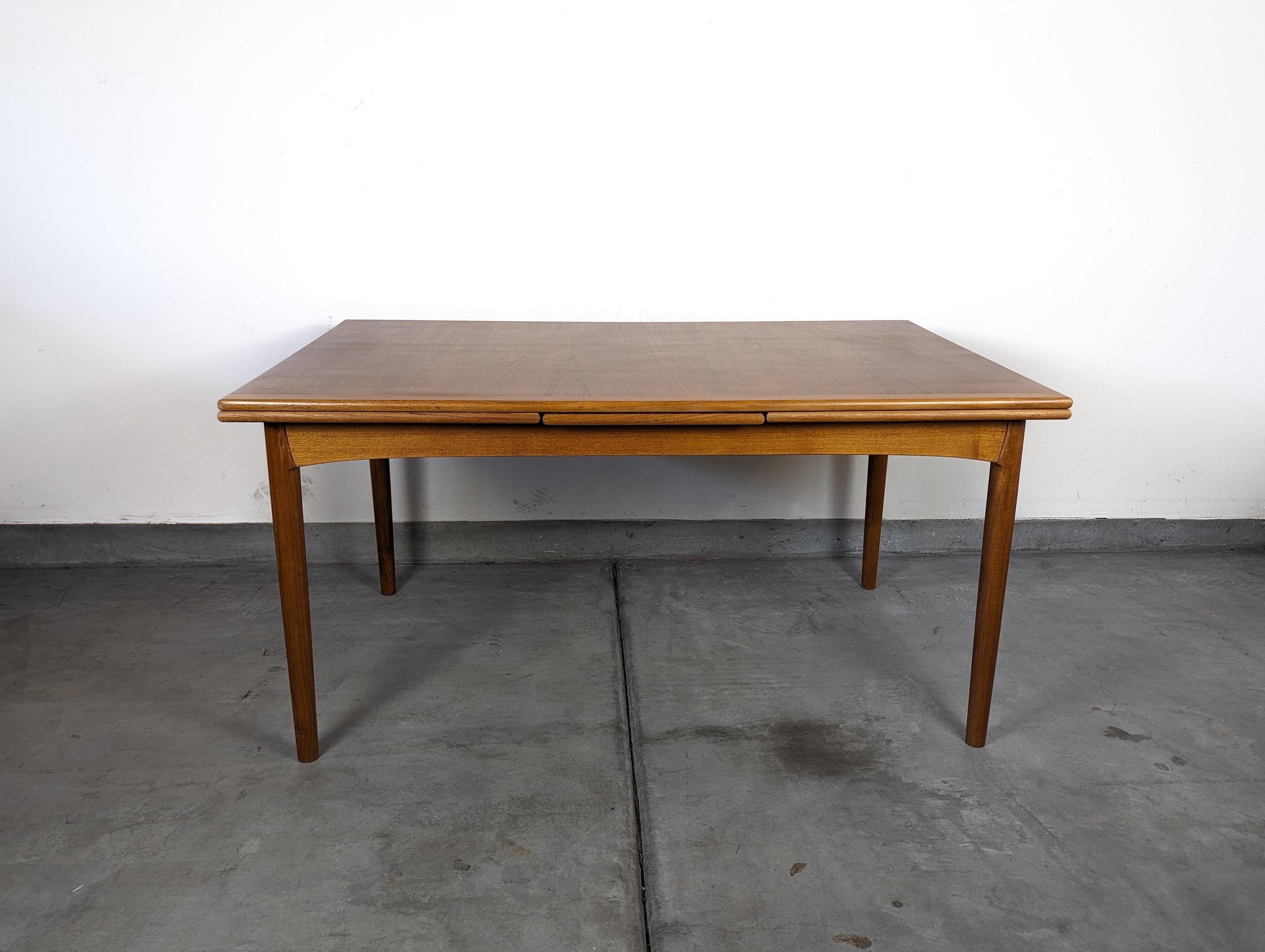 Step back into the timeless elegance of the 1960s with this beautifully preserved vintage Mid-Century Modern teak dining table by Slagelse. Crafted with an eye for detail and a passion for quality, this Danish marvel is a testament to the enduring
