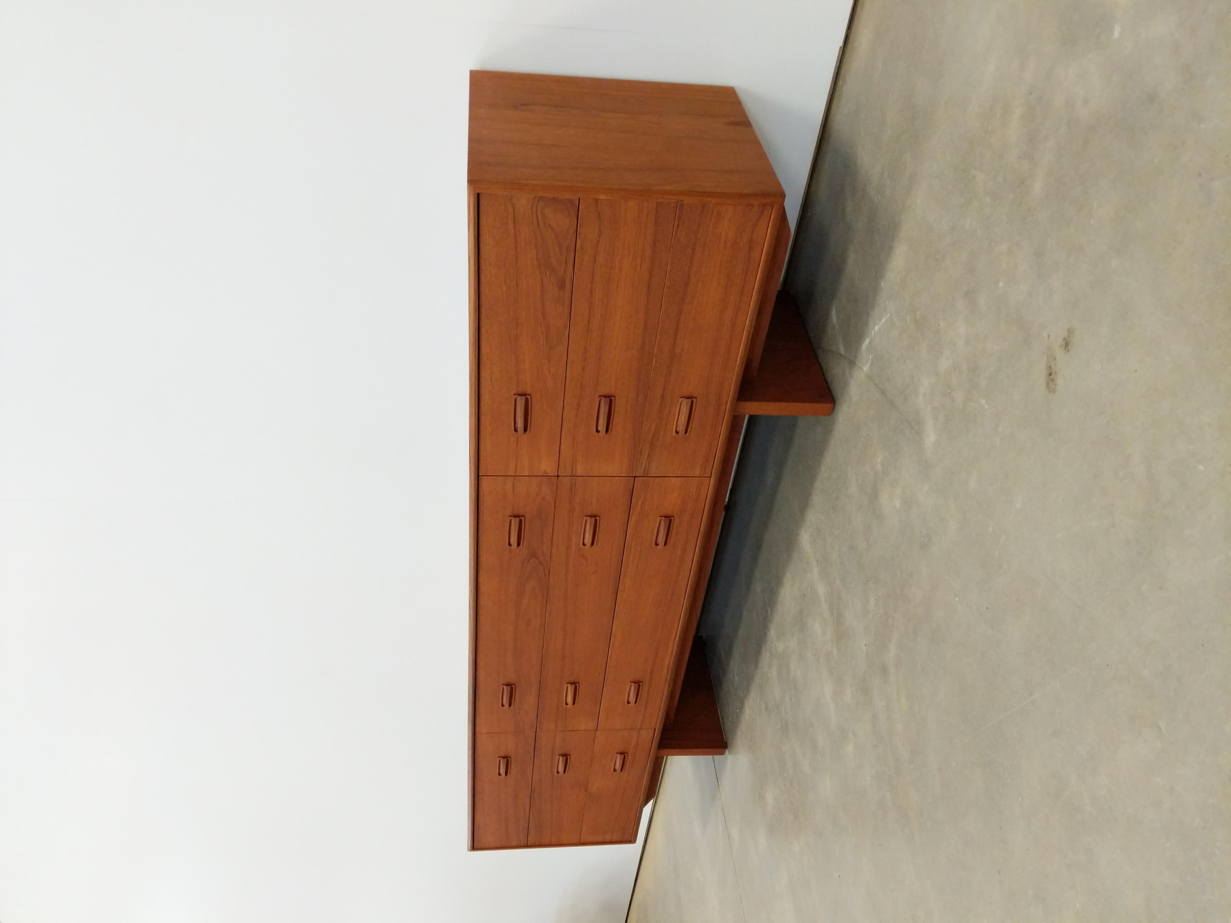 Authentic vintage mid century modern teak 9 drawer dresser.

This piece is in excellent refinished condition with very few signs of age-related wear (see photos).

If you would like any additional details, please contact us.

Dimensions:
28.25