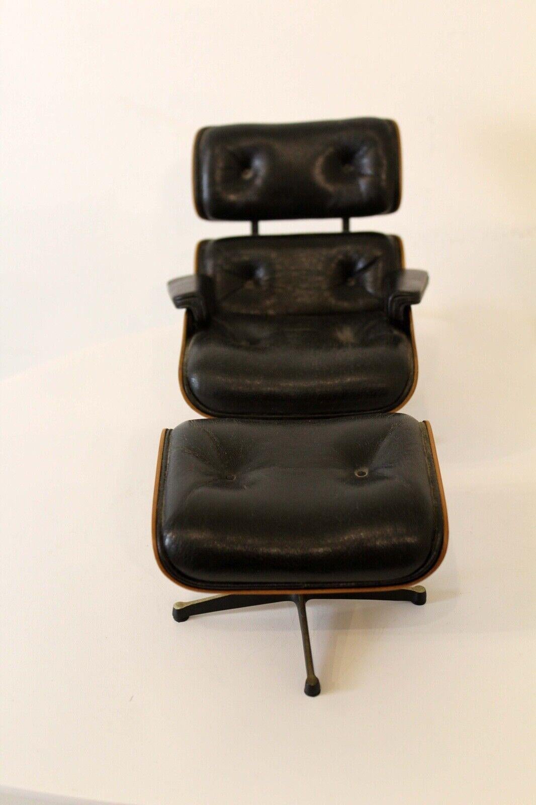 For your consideration is this cute and classy miniature of the Iconic Charles & Ray Eames for Herman Miller lounge chair and ottoman. Dimensions: Chair: 5w x 6.25d x 5h Ottoman: 4.5w x 3.5d x 2.75h.
 