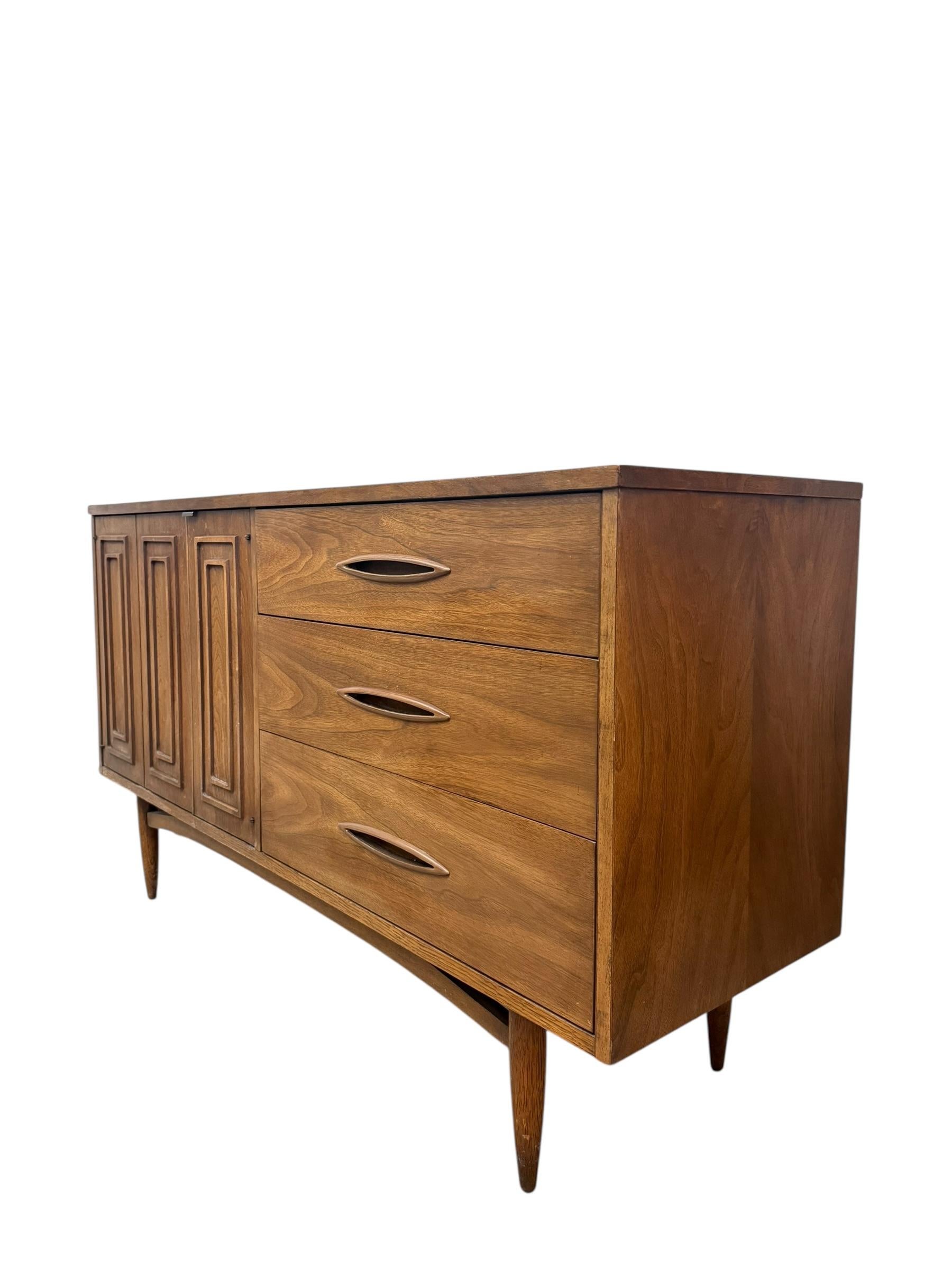 Mid-Century Modern Vintage Mid Century modern Walnut and Pecan credenza by Broyhill circa 1957. For Sale