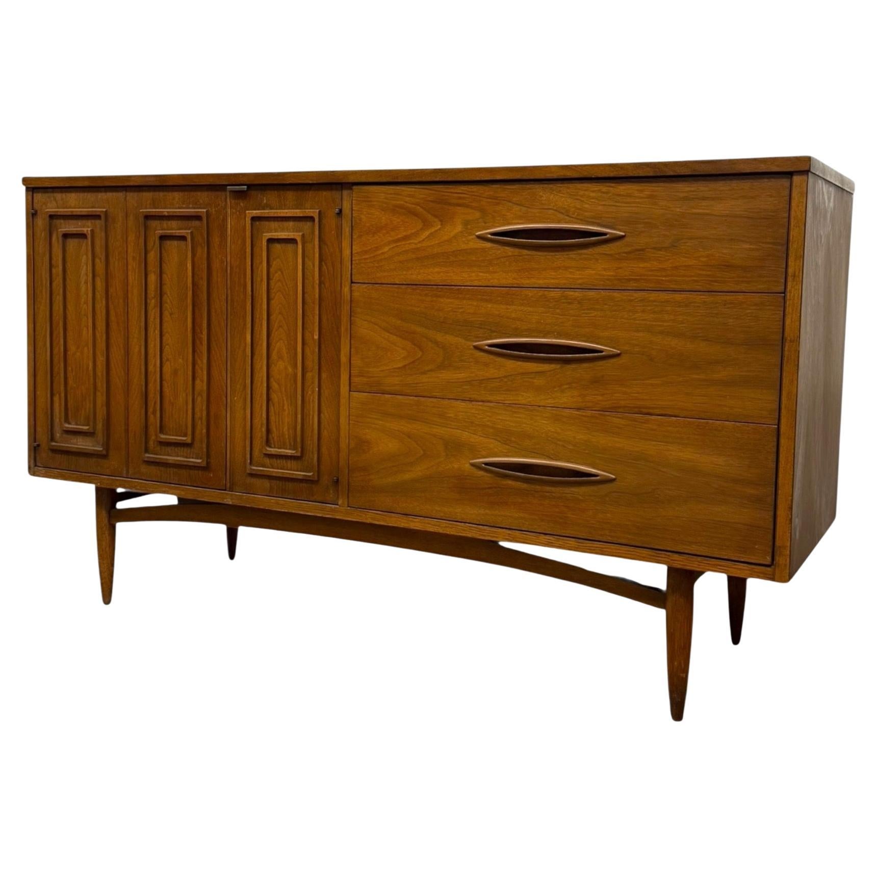 Vintage Mid Century modern Walnut and Pecan credenza by Broyhill circa 1957. For Sale