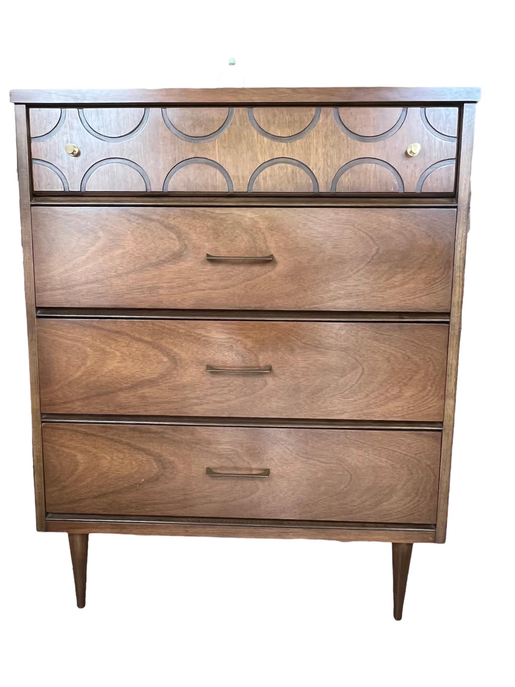 We have a beautiful Lane mid-century dresser available. The dresser has clean-lines and looks very sophisticated. This classic dresser is composed of solid walnut and original brass hardware.

Tallboy Dimensions: 34