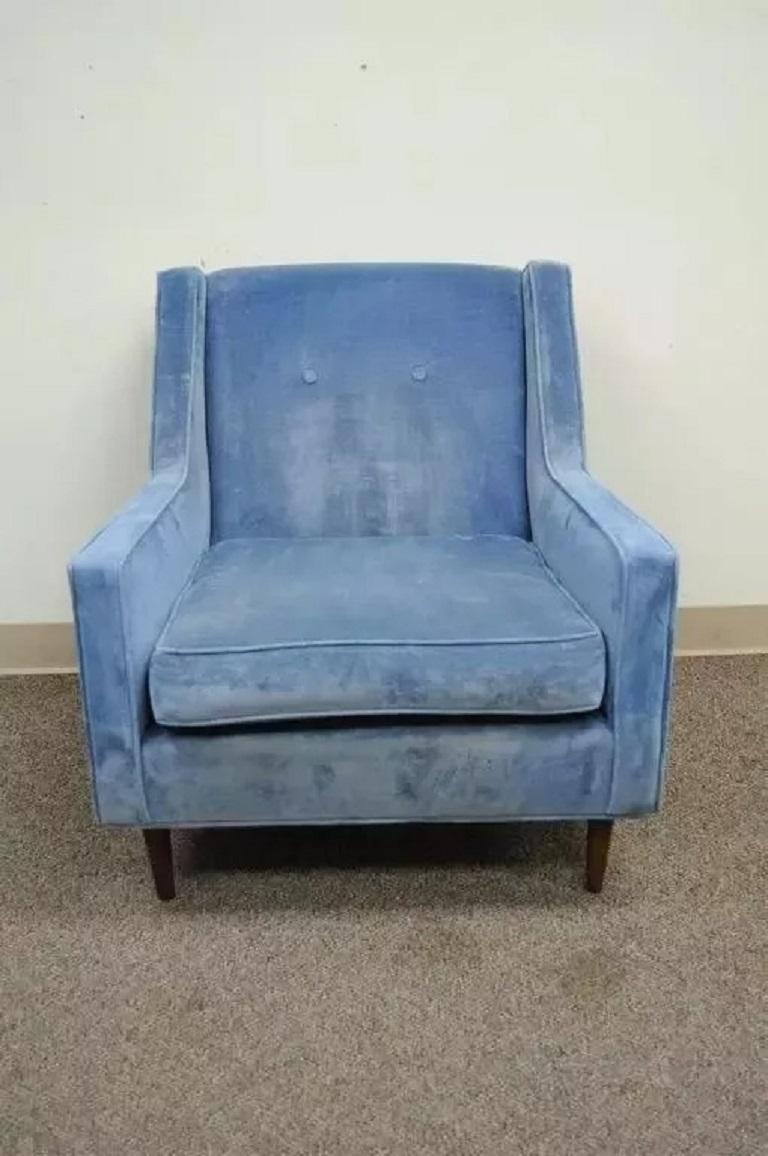 Vintage Mid Century Modern Walnut Frame Blue Club Lounge Chair after Paul McCobb. Item features a solid wood frame with angled and tapered walnut legs, blue button tufted upholstery, and great American made quality. Chair is unmarked but the style