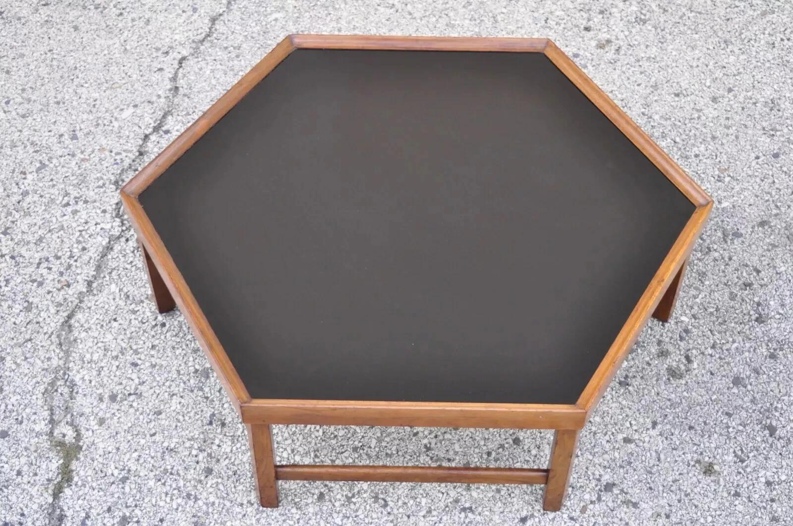 Vintage Mid Century Modern Walnut Hexagonal Coffee Table with Black Masonite Top. Circa Mid 20th Century. Measurements: 13.5