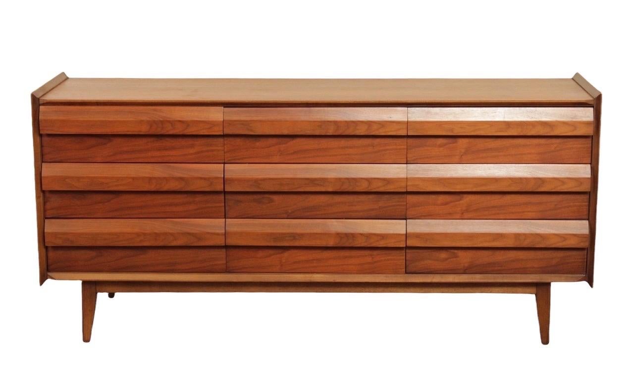 Vintage Mid-Century Modern nine drawer dresser with solid walnut wood.