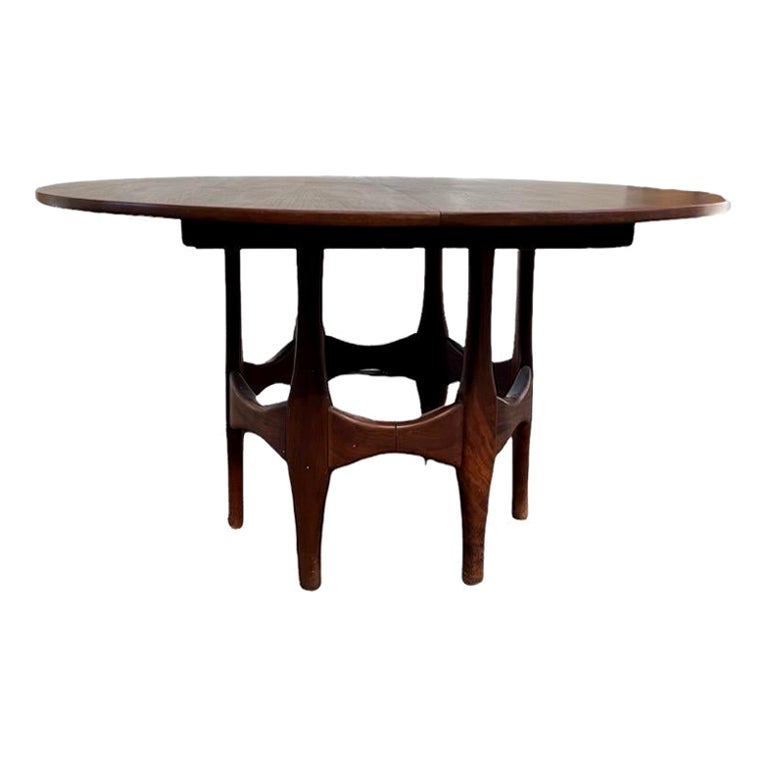 Vintage Mid-Century Modern walnut Round To Oval Extendable Dining Table