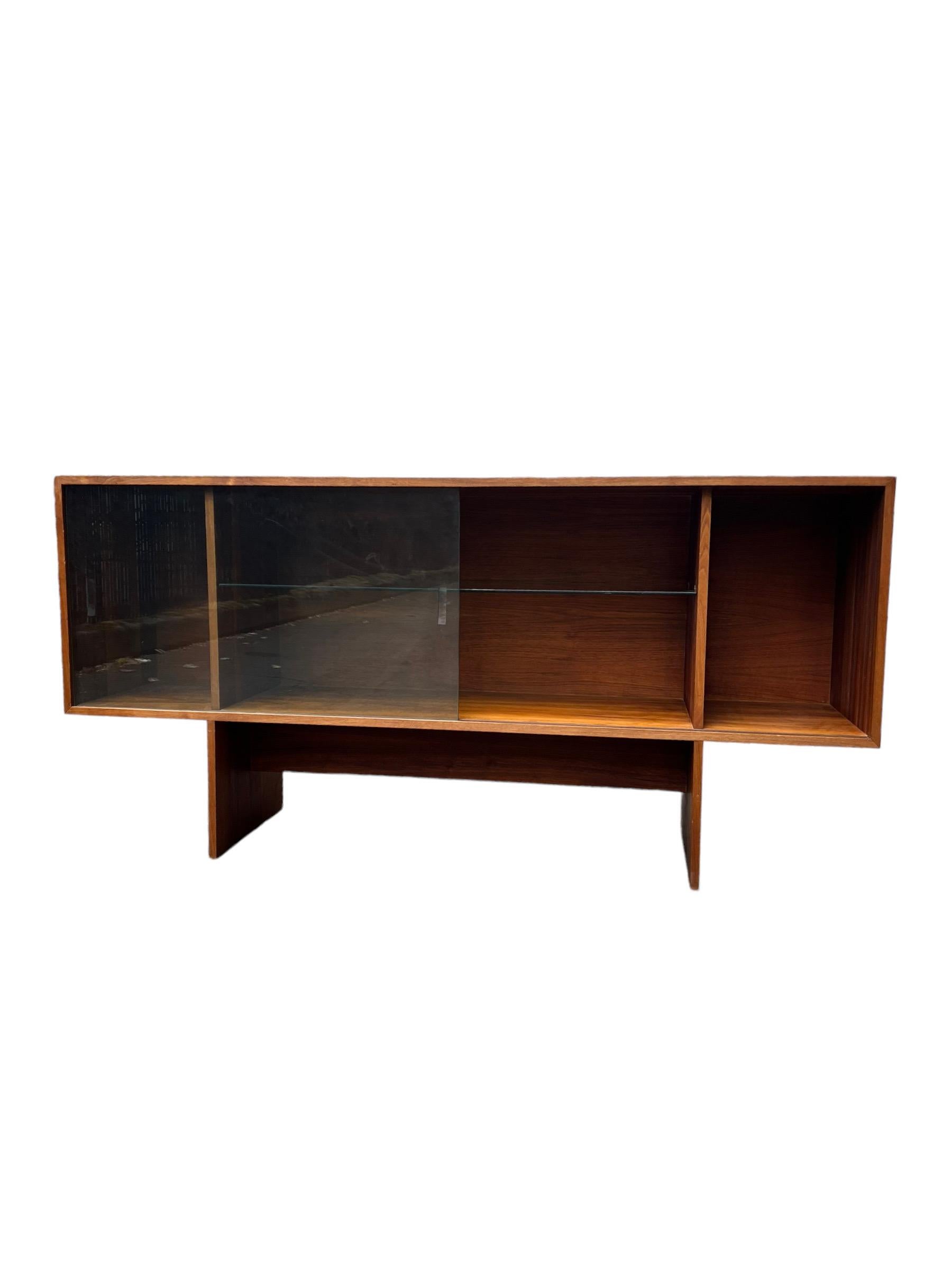Vintage Mid Century Modern Walnut Wood Book Shelf Display Cabinet Adjustable Shelf

Dimensions. 66 W ; 15 1/2 D ; 32 H
Inside ( Right ). 12 W ; 14 D ; 18 1/2 H
Inside ( Center ). 39 W ; 14 D ; 18 1/2 H
Inside ( Left ). 12 W ; 14 D ; 18 1/2 H