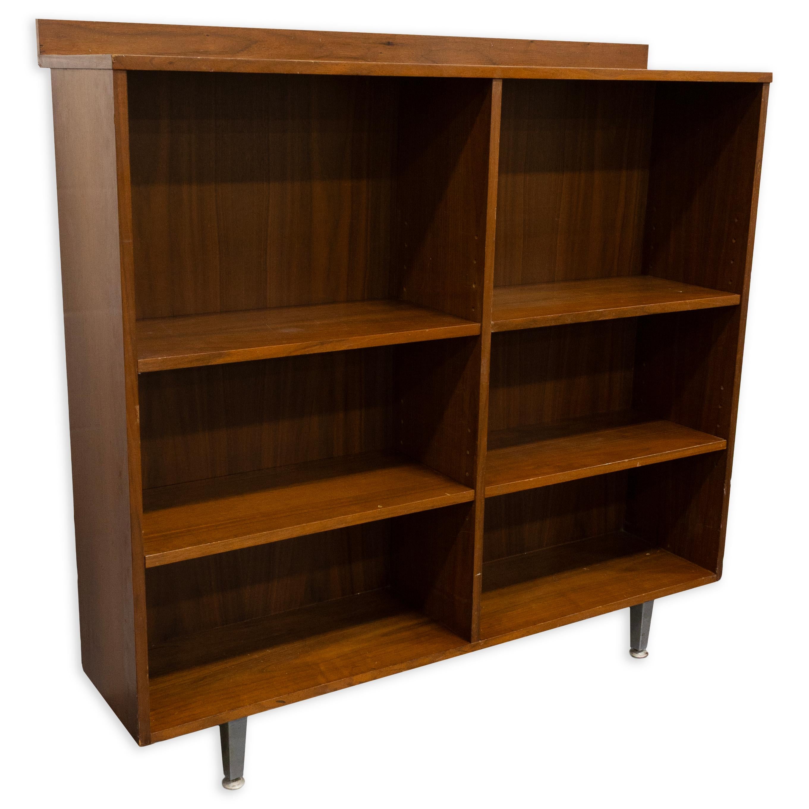 Vintage Mid-Century Modern Solid Wood Adjustable Bookshelf. This sturdy shelf is an excellent addition to a home office or living space, offering ample storage that can be customized with its adjustable design. The shelf is in fair condition, with