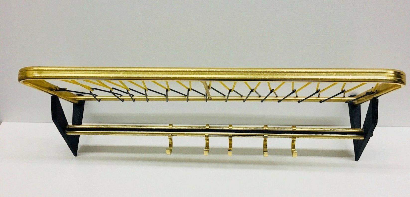 Classic Mid-Century Modern, 1950s wardrobe coat rack Art Deco style German. Nice addition to your room, entry hall or just for your collection of Design items. Made of metal and plastic strings. Found at an estate sale in Vienna, Austria.