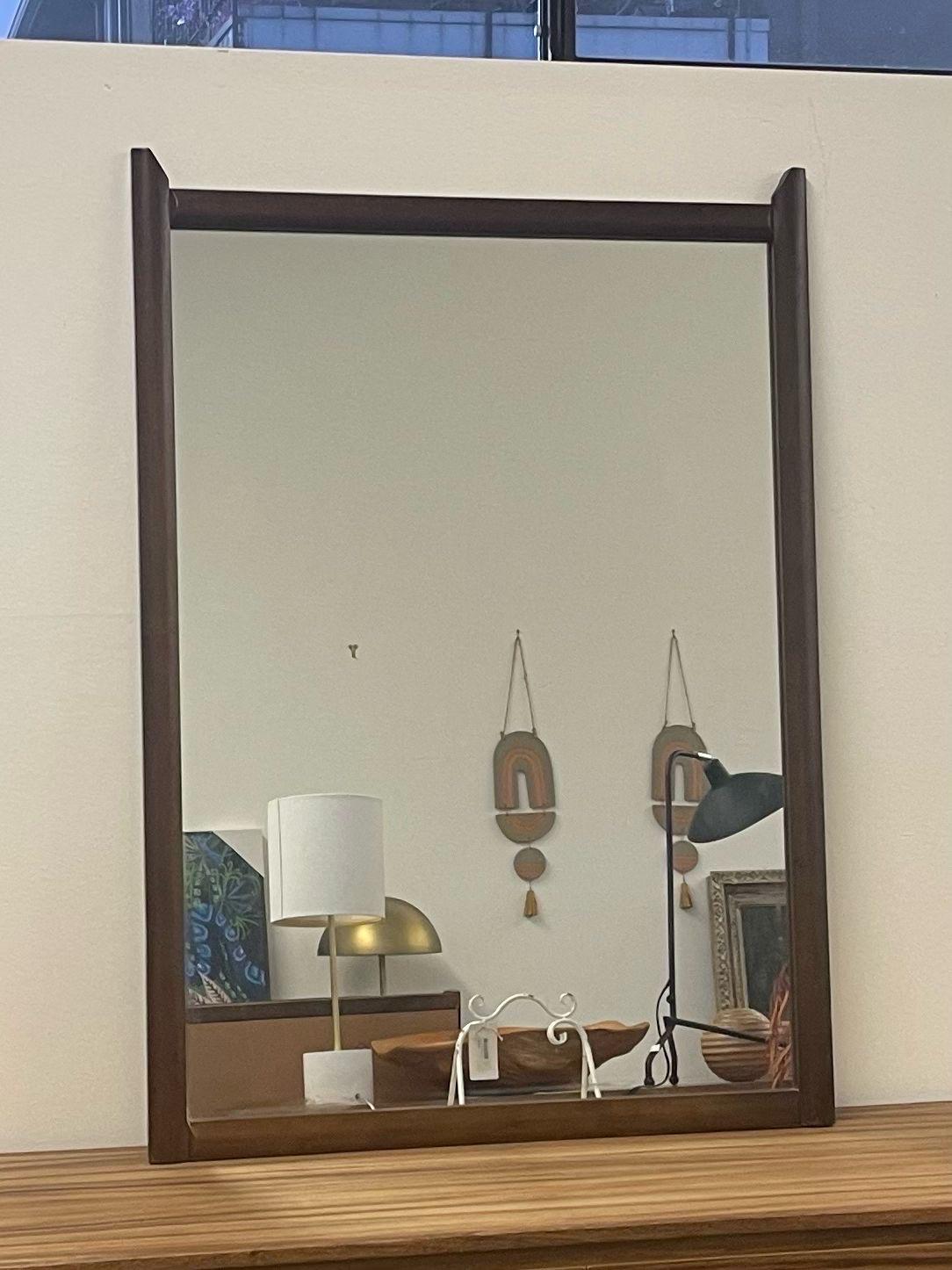 Mirror with Pointed Wood Edge. Vintage Condition Consistent with Age as Pictured.

Dimensions. 28 W ; 3/4 D ; 40 H