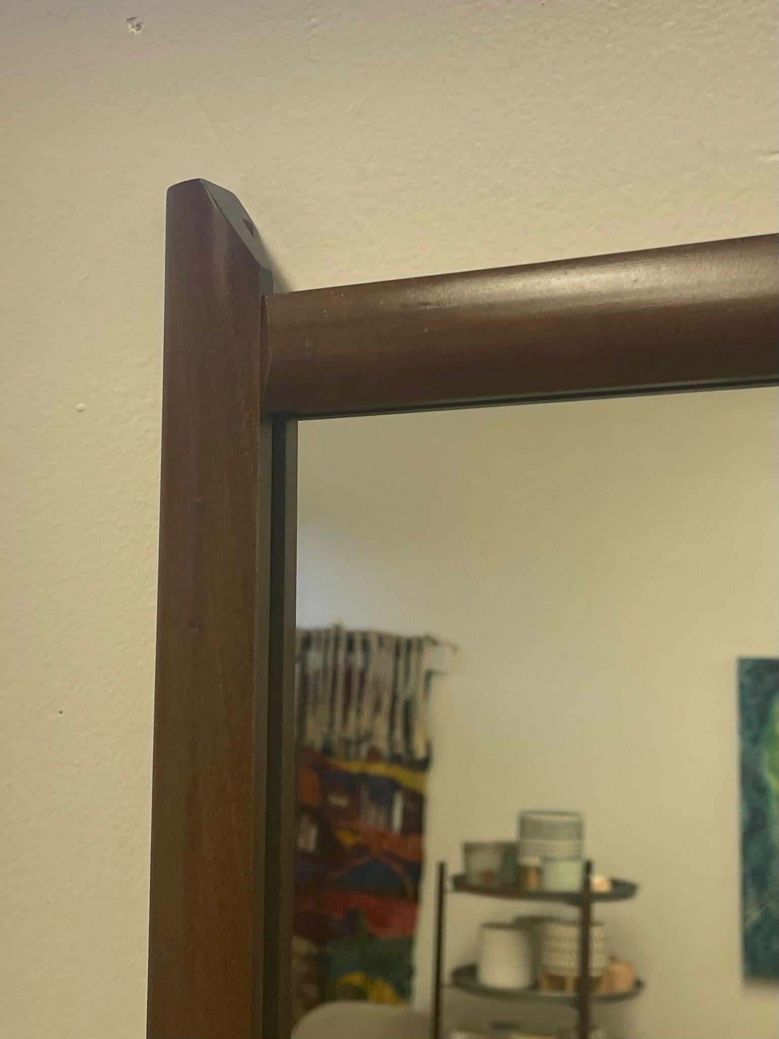Late 20th Century Vintage Mid Century Modern Wooden Framed Mirror With Sculpted Edge Top For Sale