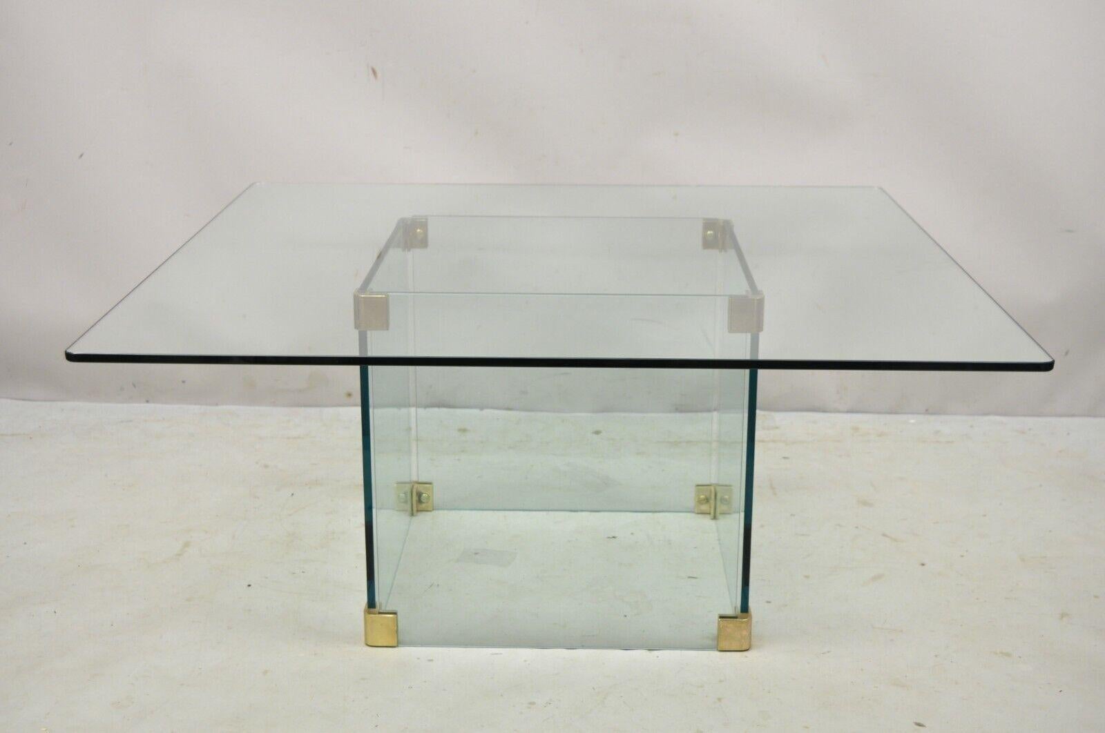 Vintage Mid-Century Modernist pace glass coffee table with glass pedestal base. Item features brass accents, glass base and top, very nice vintage item, clean modernist line, attributed to Leon Rosen for Pace, circa late 20th century. Measurements: