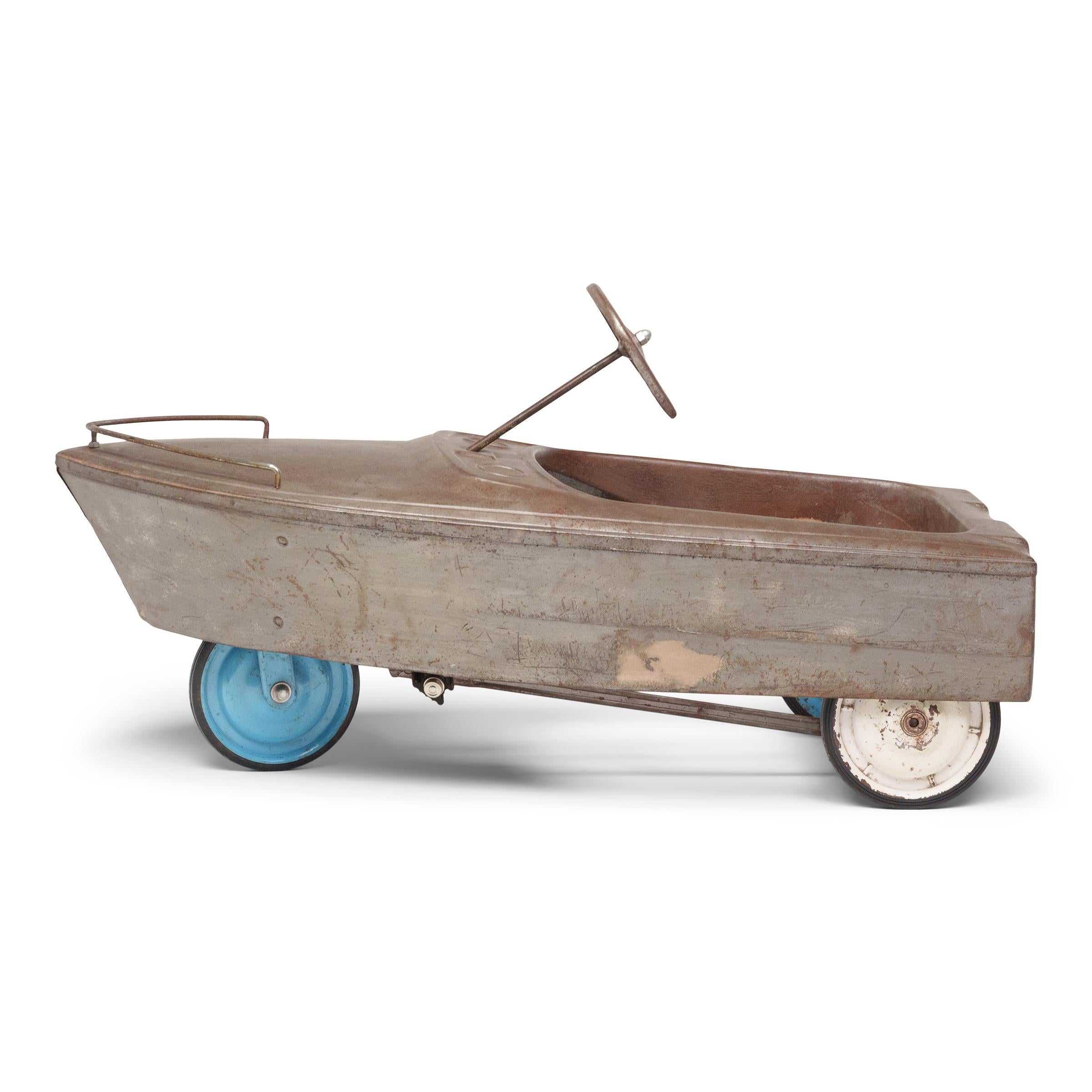 A popular toy since the late 19th century, children's pedal cars experienced a massive boom in the postwar era, becoming a staple product in the Sears catalog and in toy stores nationwide.

This example is a 1960s pedal boat by Murray Ohio