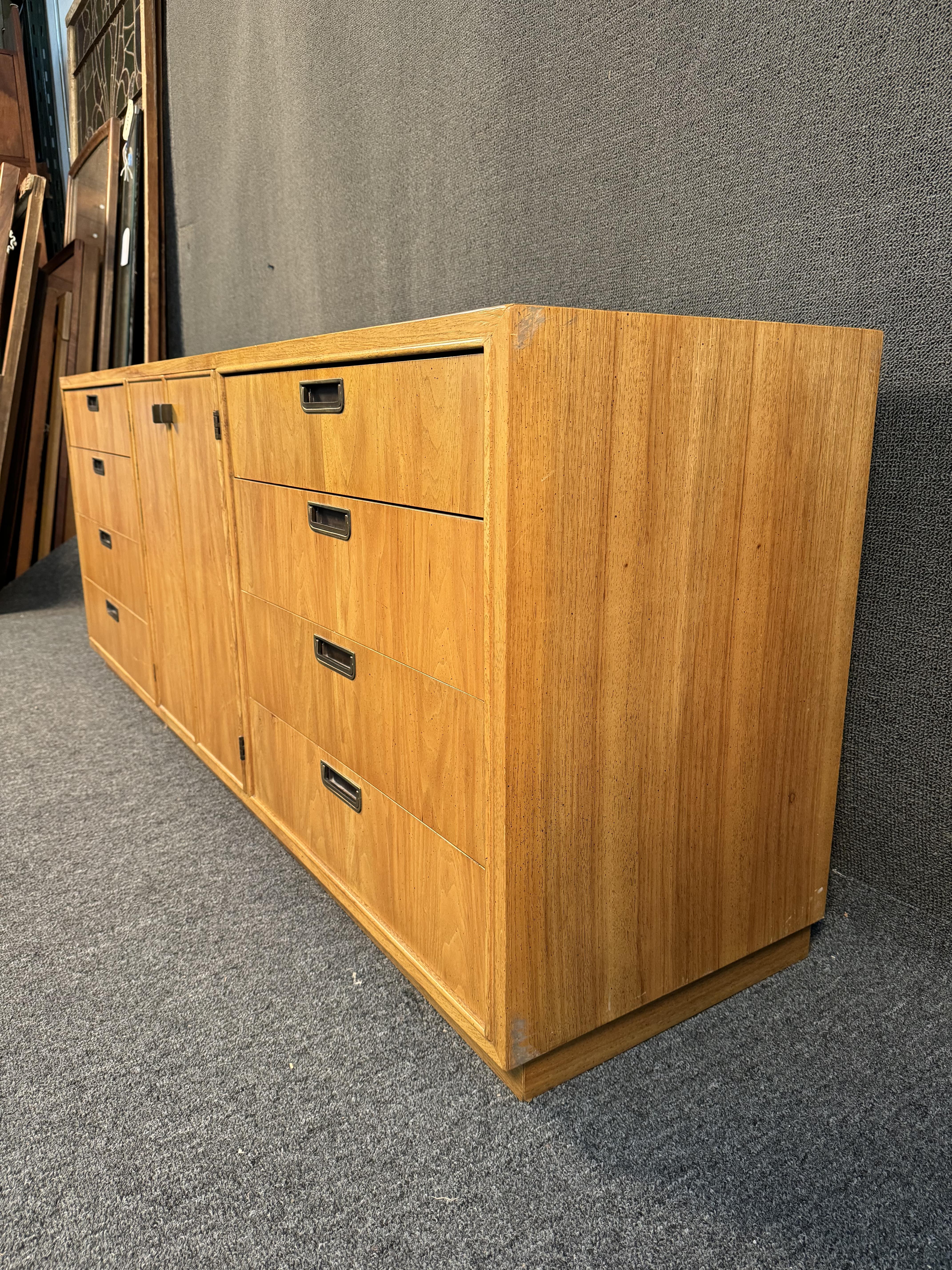Vintage MCM Oak Dresser. Featuring oak wood, metal recessed drawer pulls, and ample storage. Perfect addition to any room in need of stylish storage. Please confirm location (NY or NJ)