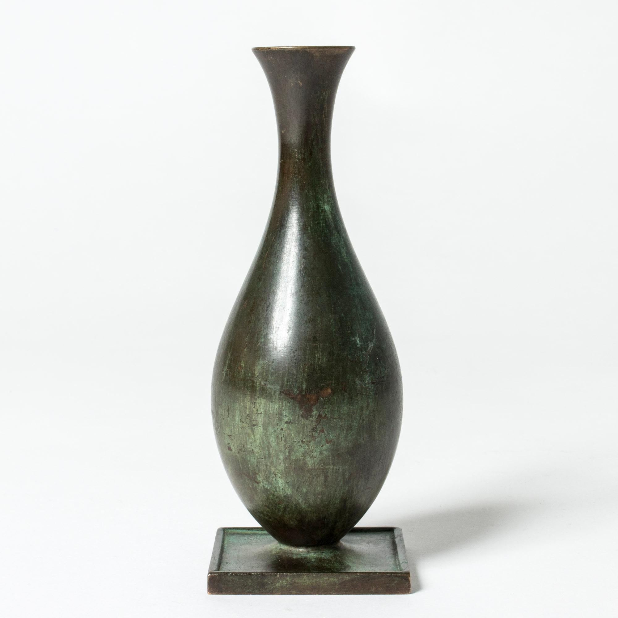 Lovley bronze vase from GAB, patinated dark green in varying nuances. Classic shape with a wide square base.

GAB was founded in Stockholm in 1867 and was an important influence on the Swedish art and crafts and industrial design scenes for more