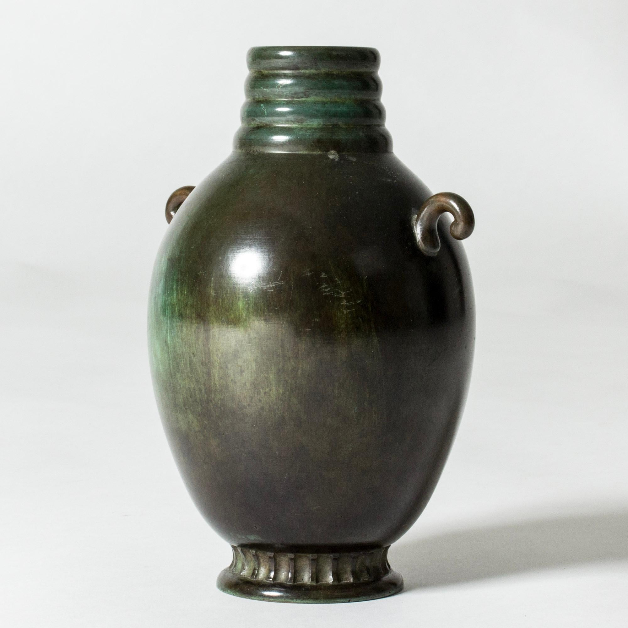 Lovely 1930s bronze vase, in a plump form with decorative handles and details. Patinated in beautiful green nuances.

GAB was founded in Stockholm in 1867 and was an important influence on the Swedish art and crafts and industrial design scenes for