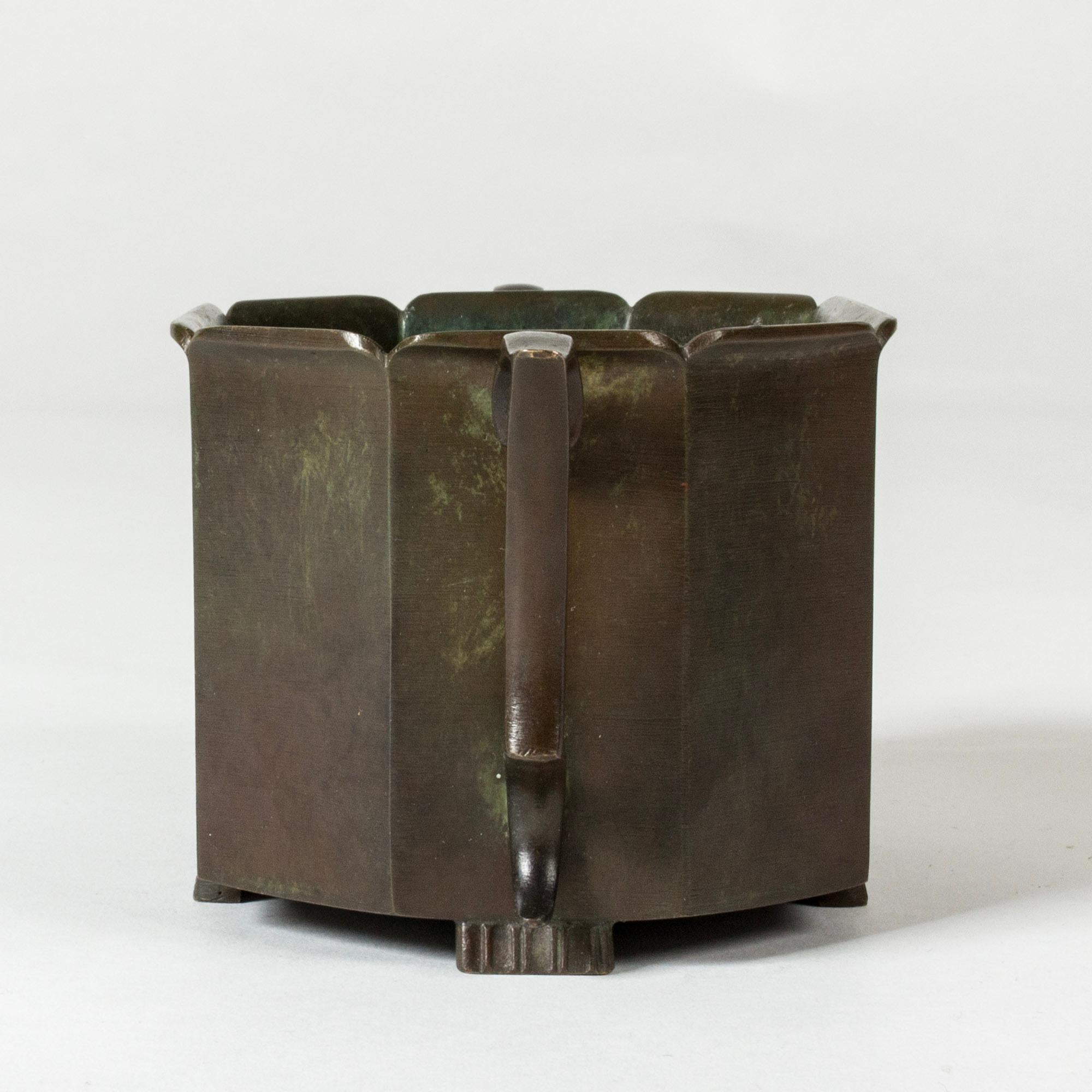 Elegant, small 1930s bronze planter from GAB, in a eight-sided form with lovely elaborate handles.

GAB was founded in Stockholm in 1867 and was an important influence on the Swedish art and crafts and industrial design scenes for more than a